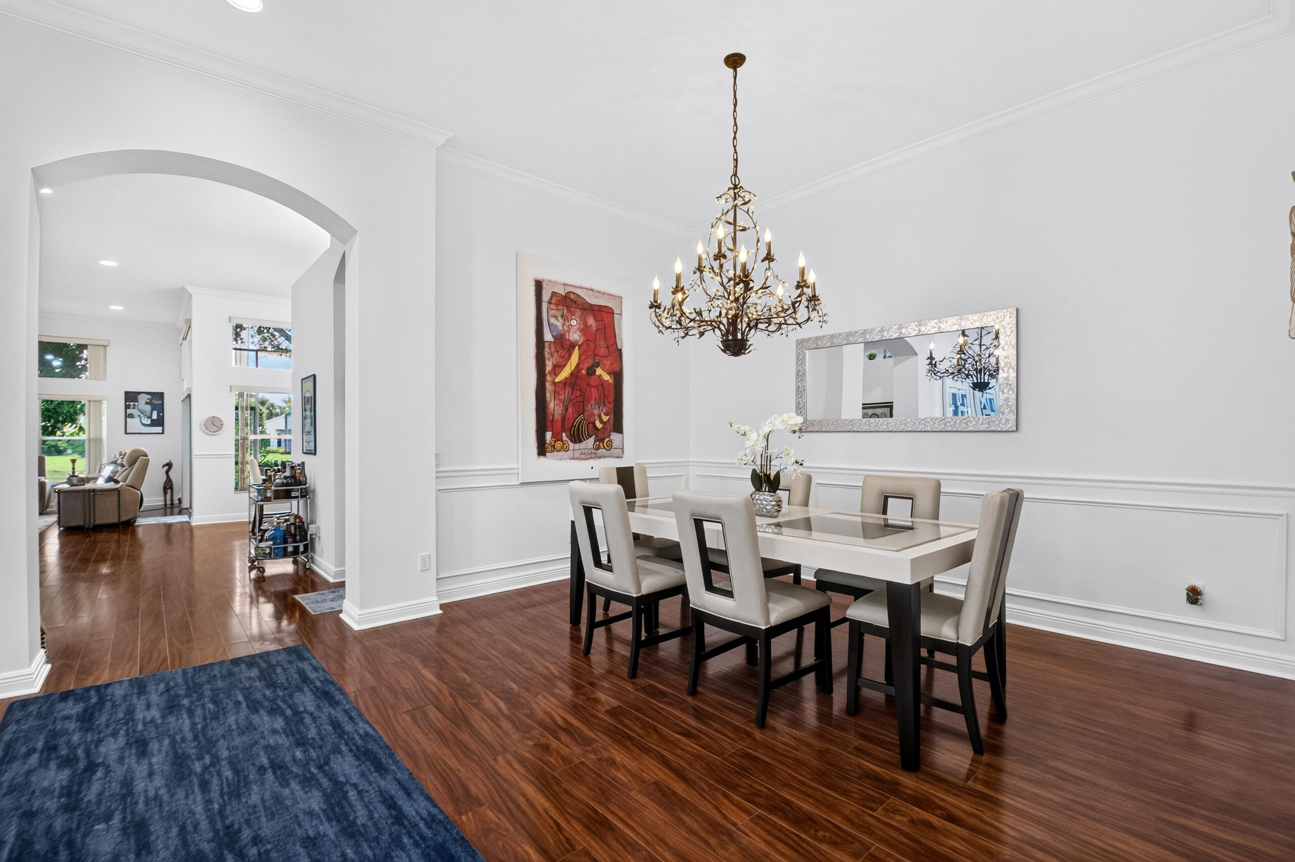 The Chandelier adds a touch of glamour & sophistication. Custom Molding on the Walls.