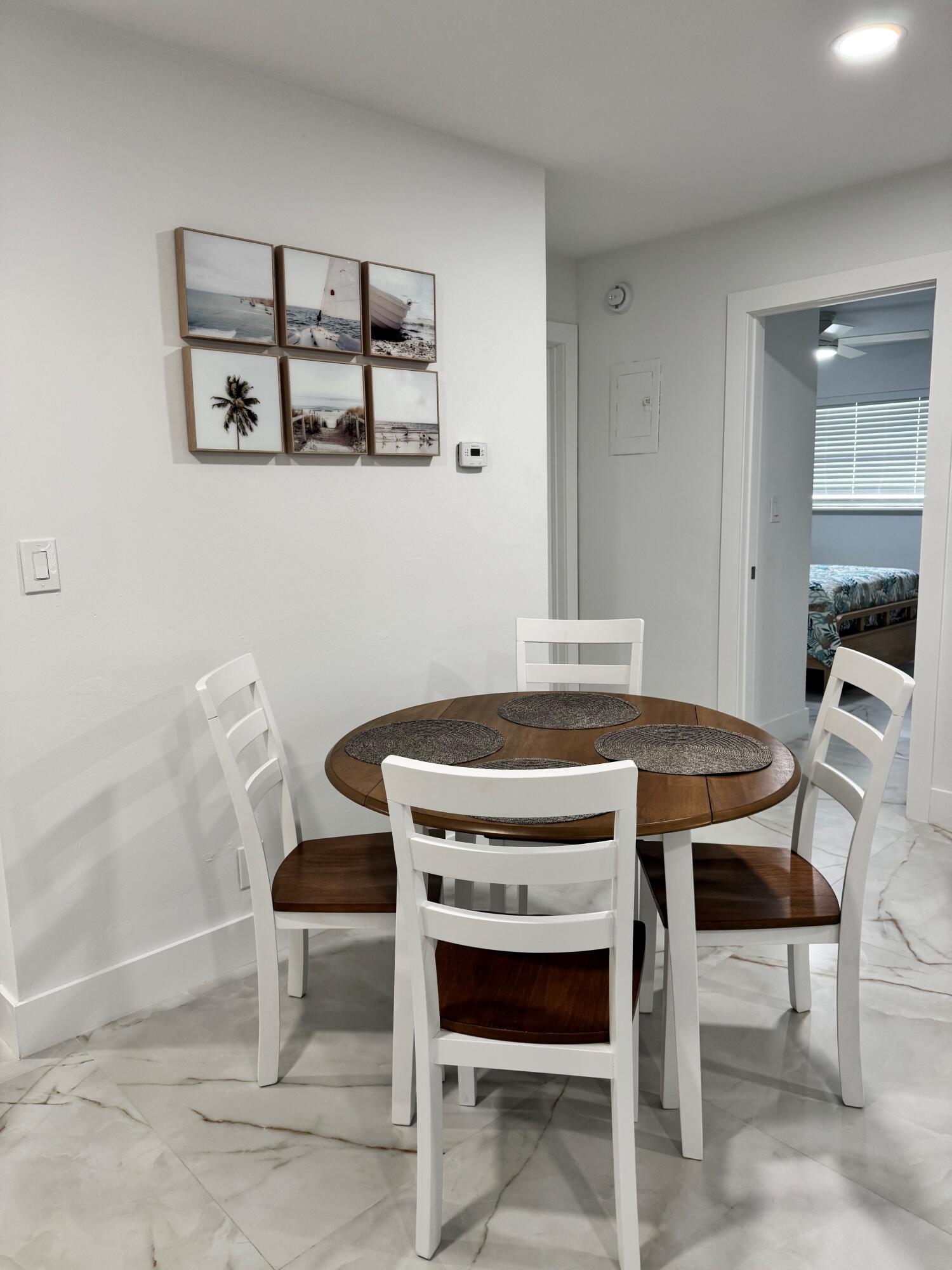White walls, recessed lighting, and tile flooring White walls, recessed lighting, and tile flooring
