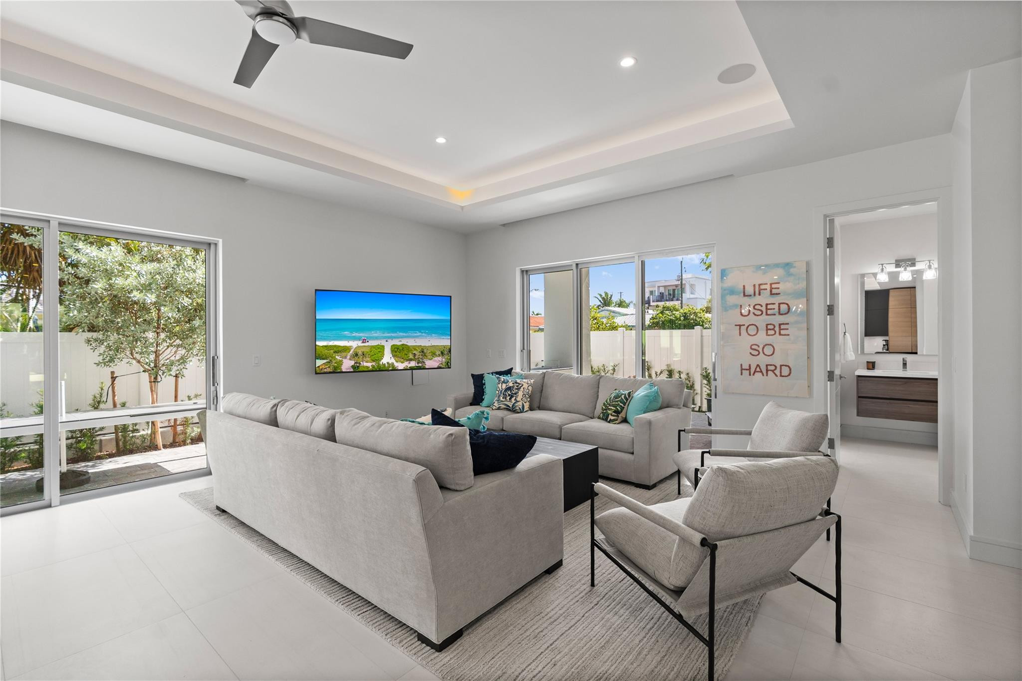 Open concept living area and kitchen - A remarkable luxury townhome rental that redefines upscale living in the heart of Lauderdale By The Sea. This beautifully designed 3,027 sq. ft residence features 4 spacious beds & 4 baths, making it perfect for families or those who love to entertain.The home also offers an outdoor kitchen and BBQ area, along with a private plunge pool that invites relaxation and fun. For boating enthusiasts, a boat slip is also available for rent. Easy access to a plethora of amenities, beach, dining, & entertainment.