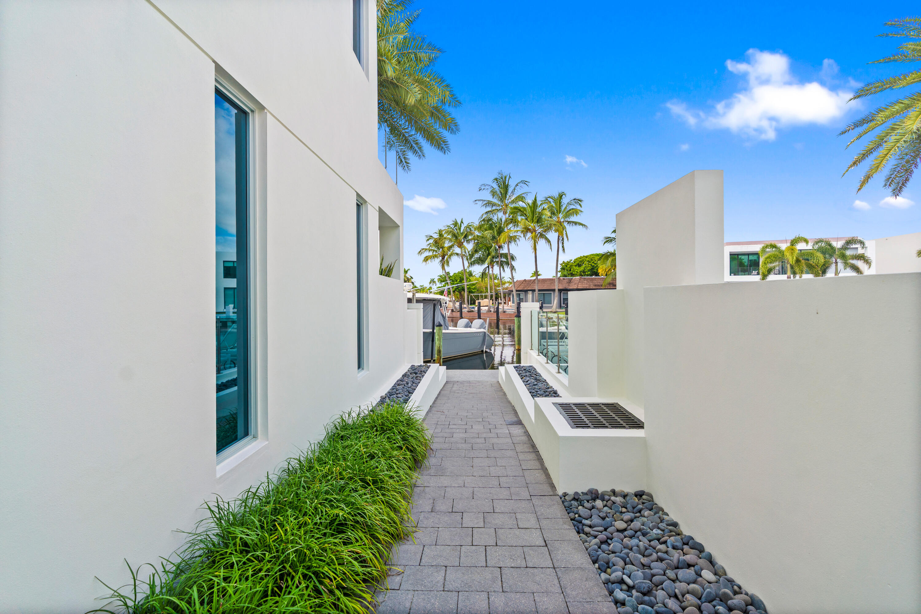221 Shore Ct Community Pool Entry. A remarkable luxury townhome rental that redefines upscale living in the heart of Lauderdale By The Sea. This beautifully designed 3,027 sq. ft residence features 4 spacious beds & 4 baths, making it perfect for families or those who love to entertain.The home also offers an outdoor kitchen and BBQ area, along with a private plunge pool that invites relaxation and fun. For boating enthusiasts, a boat slip is also available for rent. Easy access to a plethora of amenities, beach, dining, & entertainment.