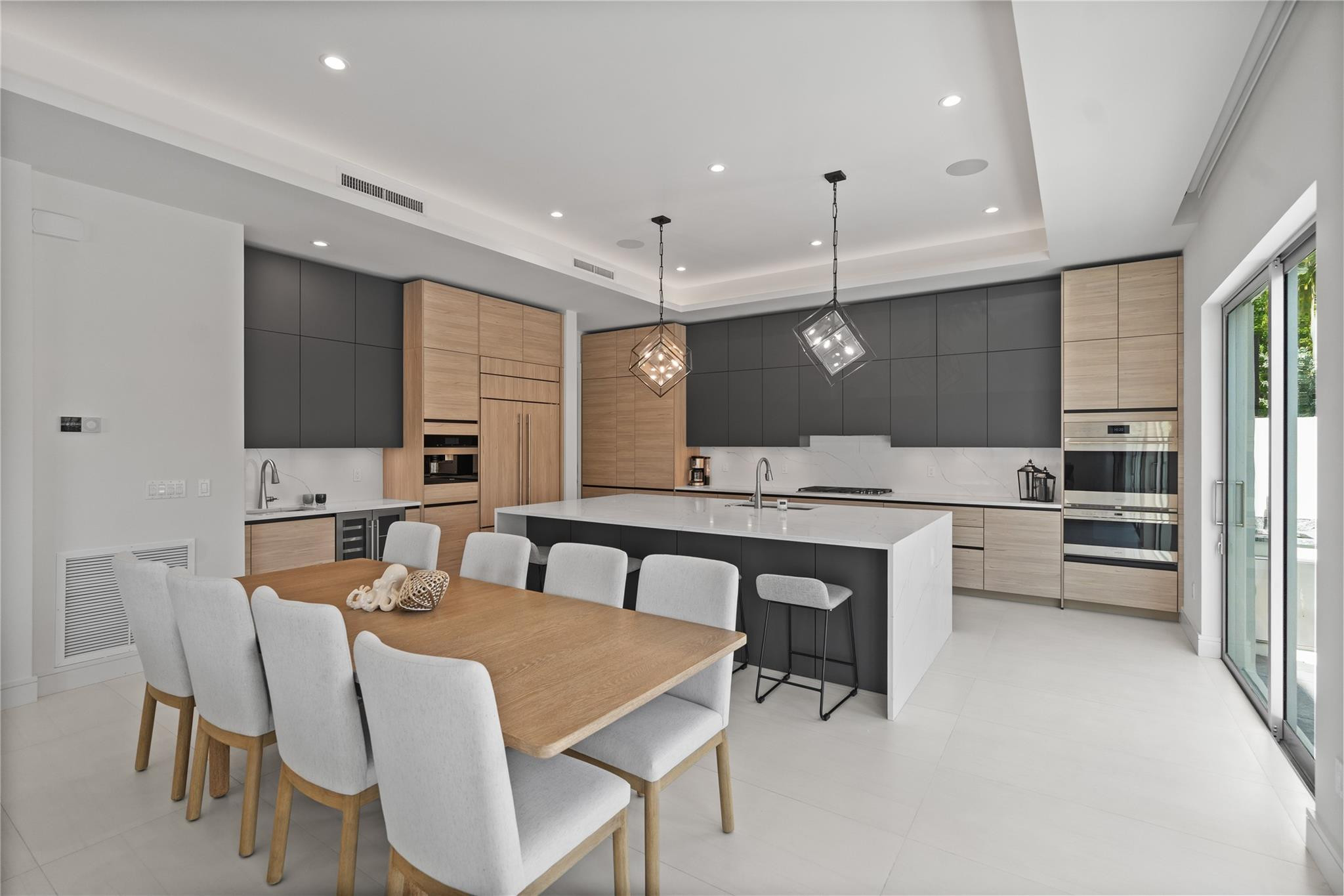 A custom designer kitchen with top of the line appliances, huge island, and tons of cabinetry storage. A remarkable luxury townhome rental that redefines upscale living in the heart of Lauderdale By The Sea. This beautifully designed 3,027 sq. ft residence features 4 spacious beds & 4 baths, making it perfect for families or those who love to entertain.The home also offers an outdoor kitchen and BBQ area, along with a private plunge pool that invites relaxation and fun. For boating enthusiasts, a boat slip is also available for rent. Easy access to a plethora of amenities, beach, dining, & entertainment.