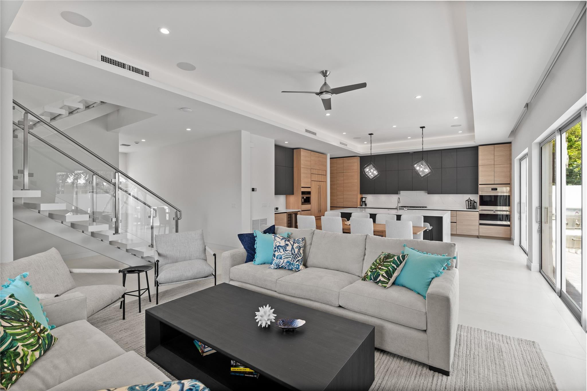Open concept living area and kitchen - A remarkable luxury townhome rental that redefines upscale living in the heart of Lauderdale By The Sea. This beautifully designed 3,027 sq. ft residence features 4 spacious beds & 4 baths, making it perfect for families or those who love to entertain.The home also offers an outdoor kitchen and BBQ area, along with a private plunge pool that invites relaxation and fun. For boating enthusiasts, a boat slip is also available for rent. Easy access to a plethora of amenities, beach, dining, & entertainment.