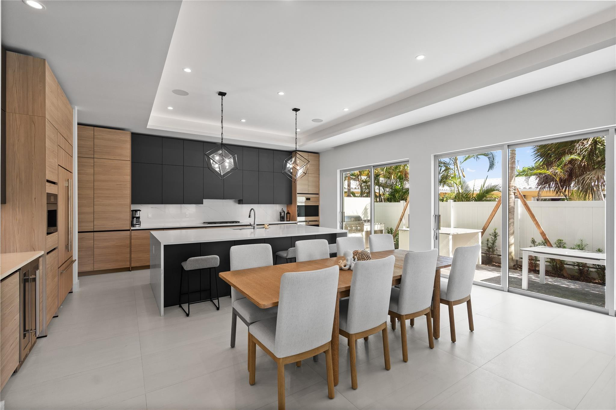 A custom designer kitchen with top of the line appliances, huge island, and tons of cabinetry storage. A remarkable luxury townhome rental that redefines upscale living in the heart of Lauderdale By The Sea. This beautifully designed 3,027 sq. ft residence features 4 spacious beds & 4 baths, making it perfect for families or those who love to entertain.The home also offers an outdoor kitchen and BBQ area, along with a private plunge pool that invites relaxation and fun. For boating enthusiasts, a boat slip is also available for rent. Easy access to a plethora of amenities, beach, dining, & entertainment.