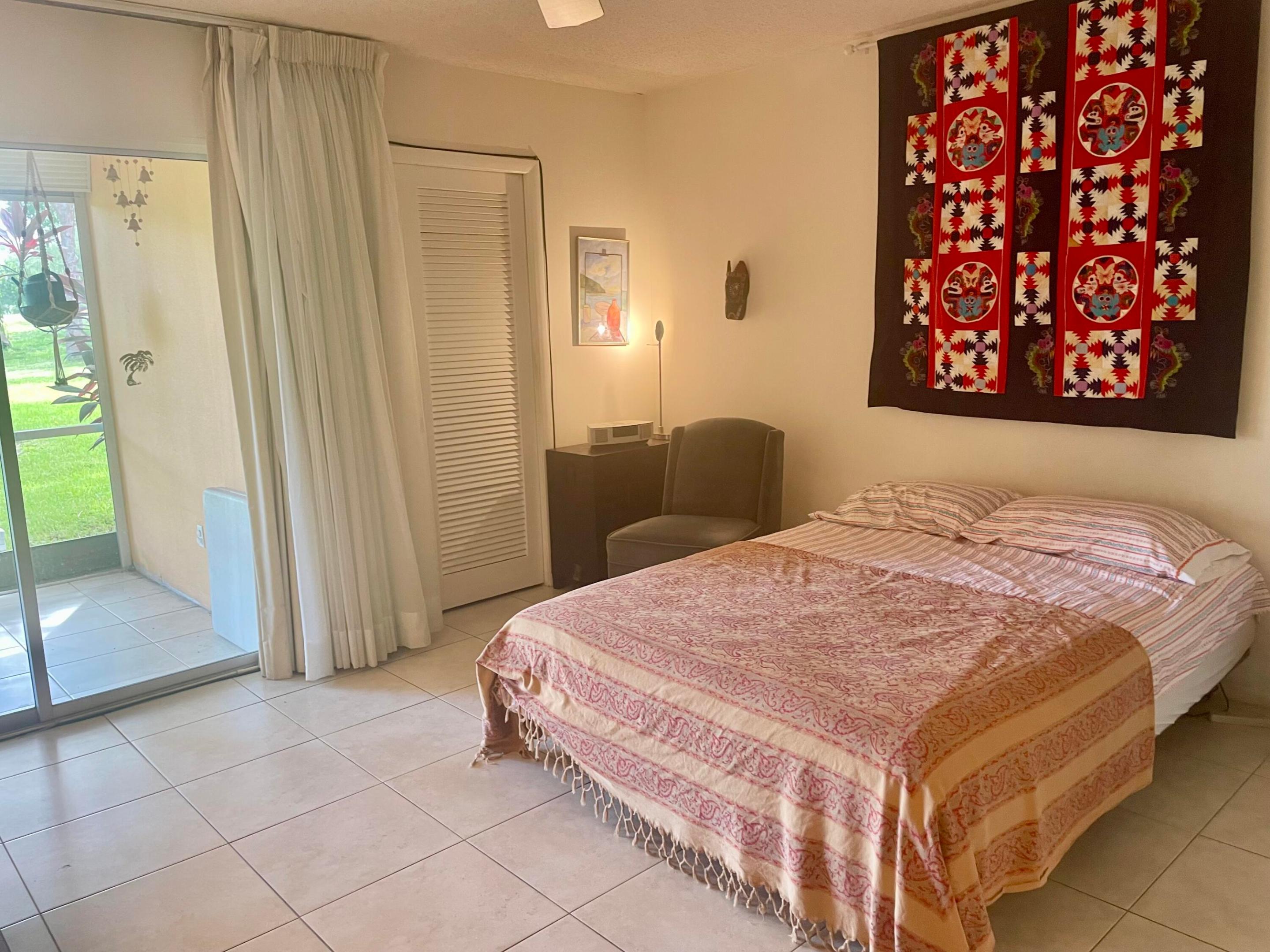 Primary Bedroom with Large Walk In Closet & Sliding Doors to the Patio