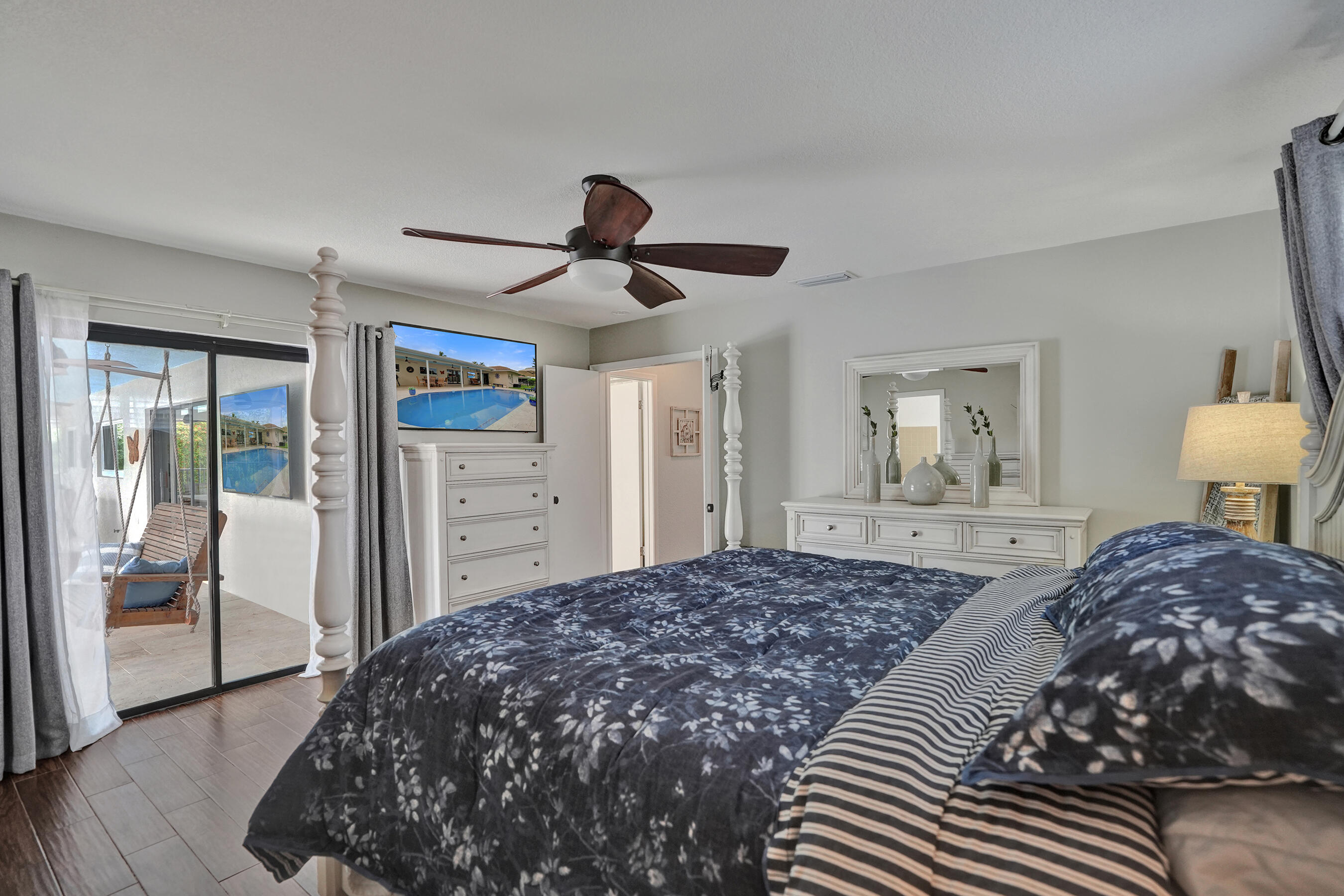Primary bedroom leads out to pool area