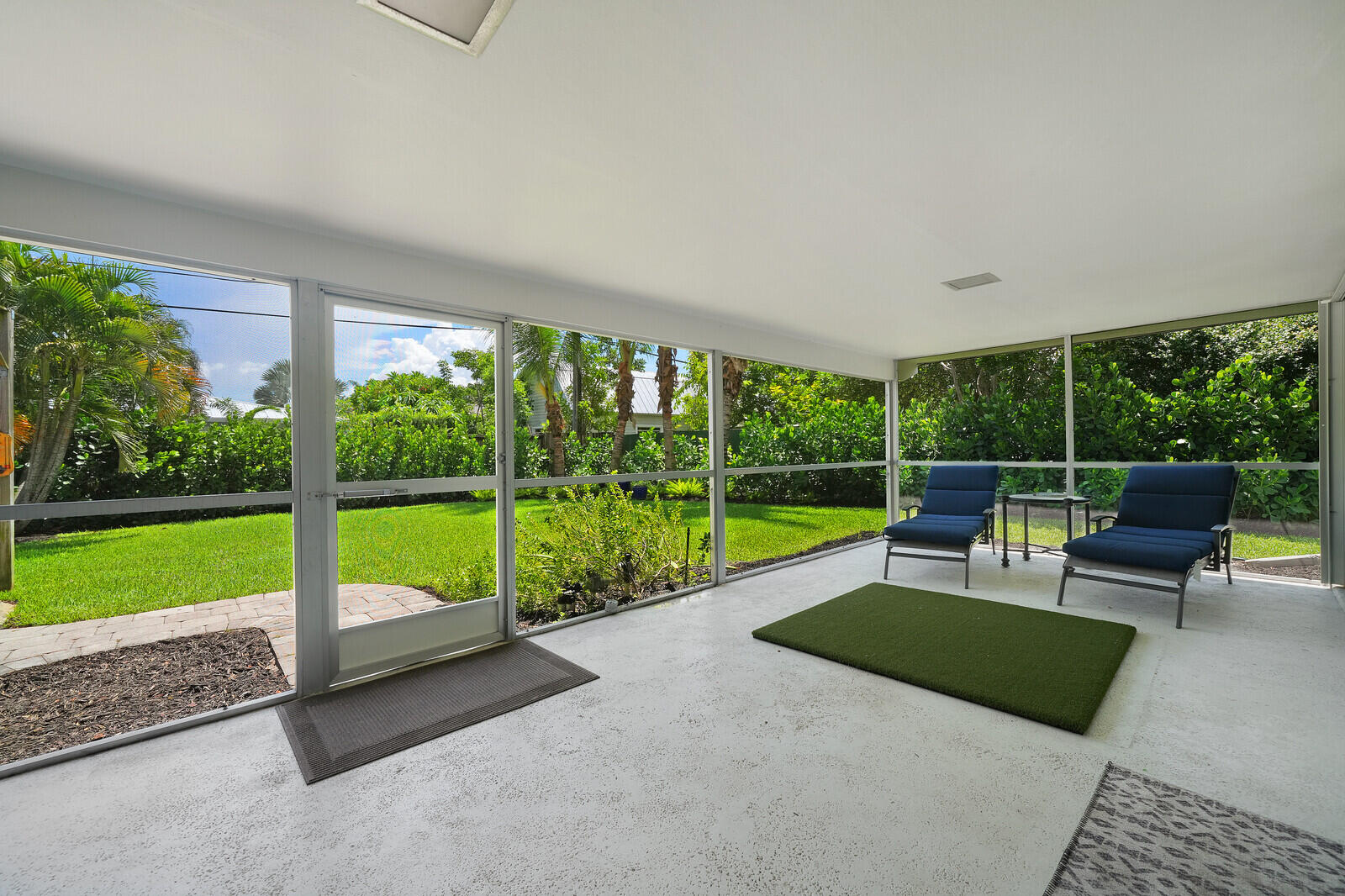 LARGE COVERED AND SCREENED PATIO SPACE