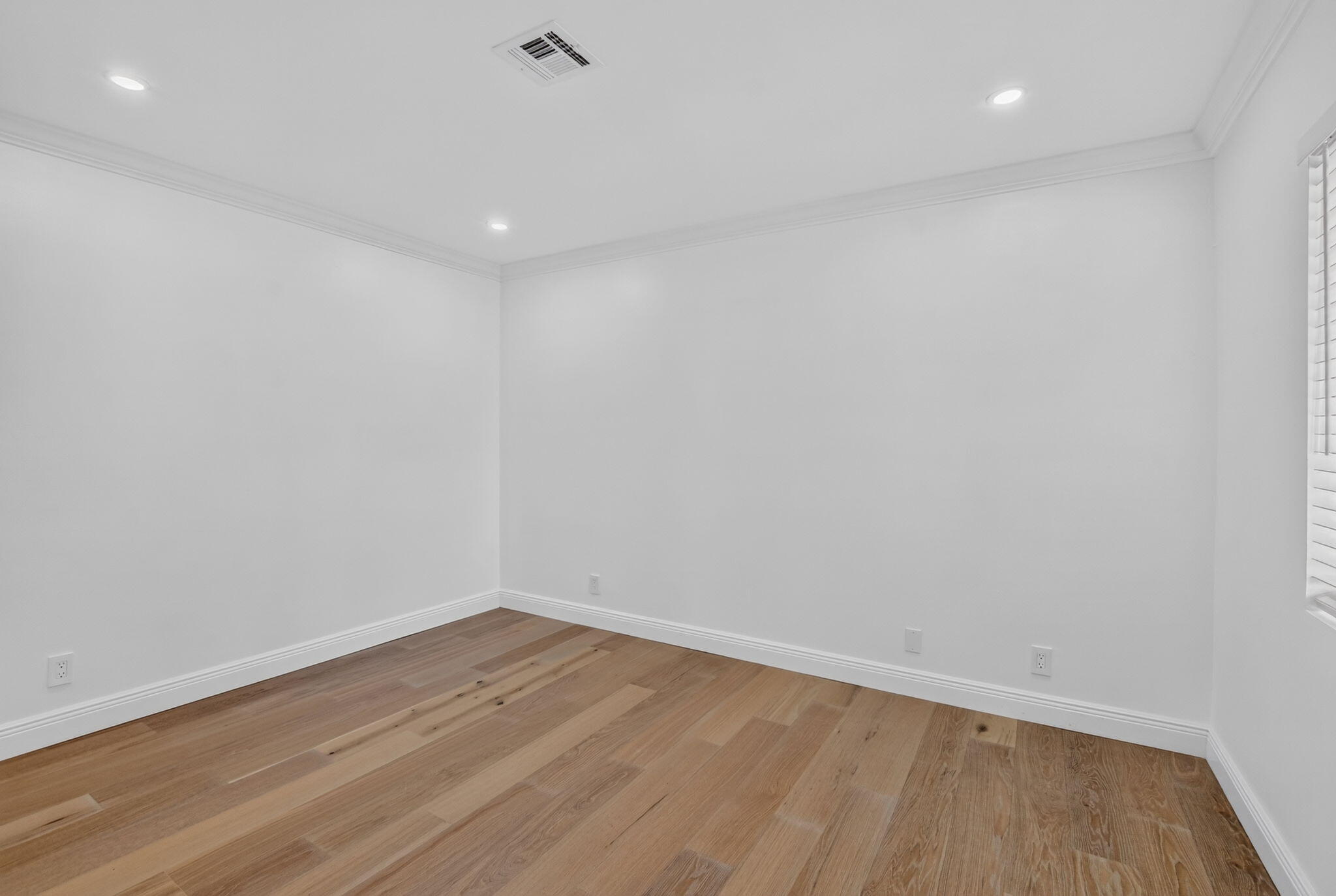 Spacious guest bedroom with closet system