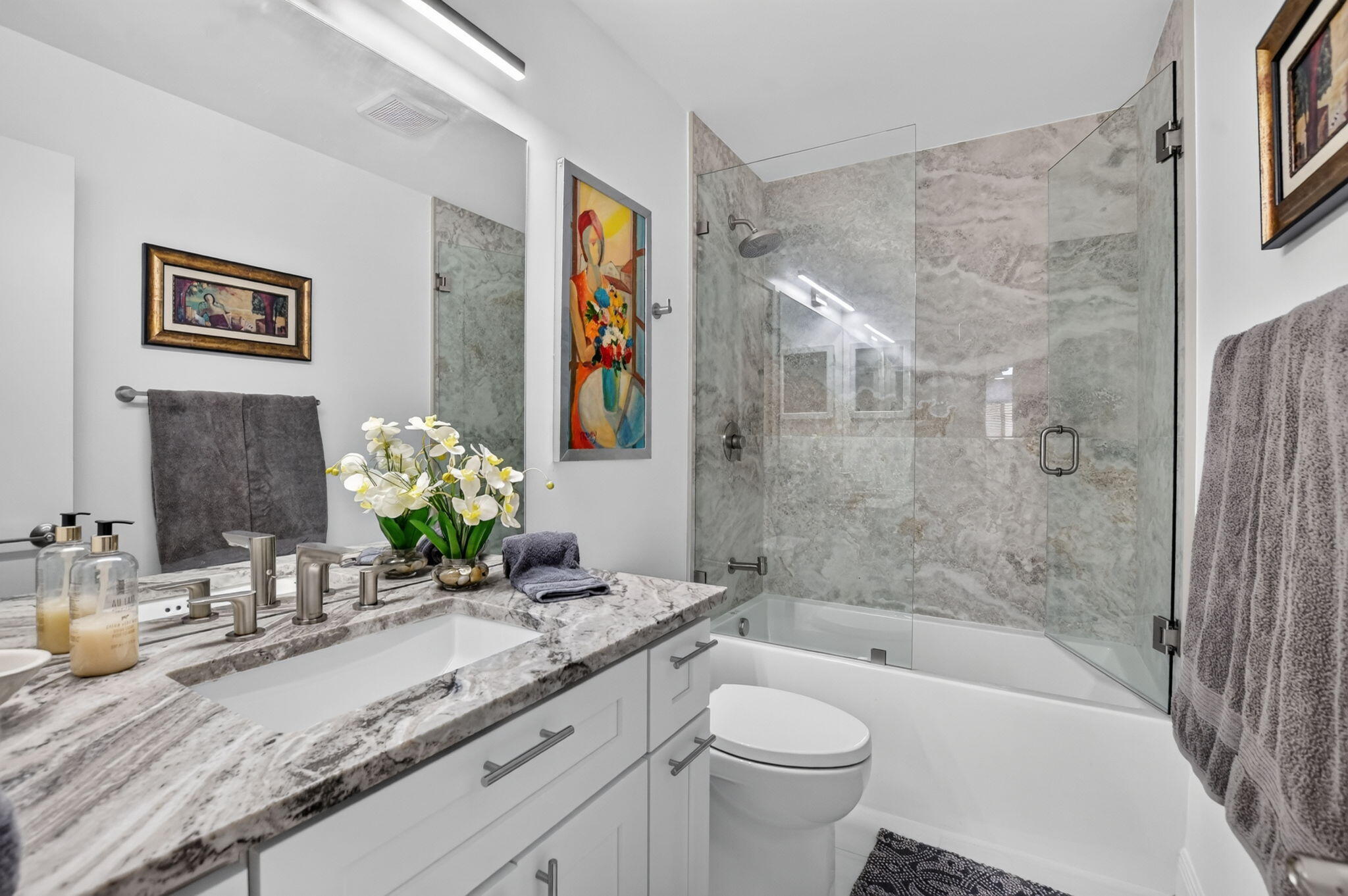 Guest bath features deep saoker tub