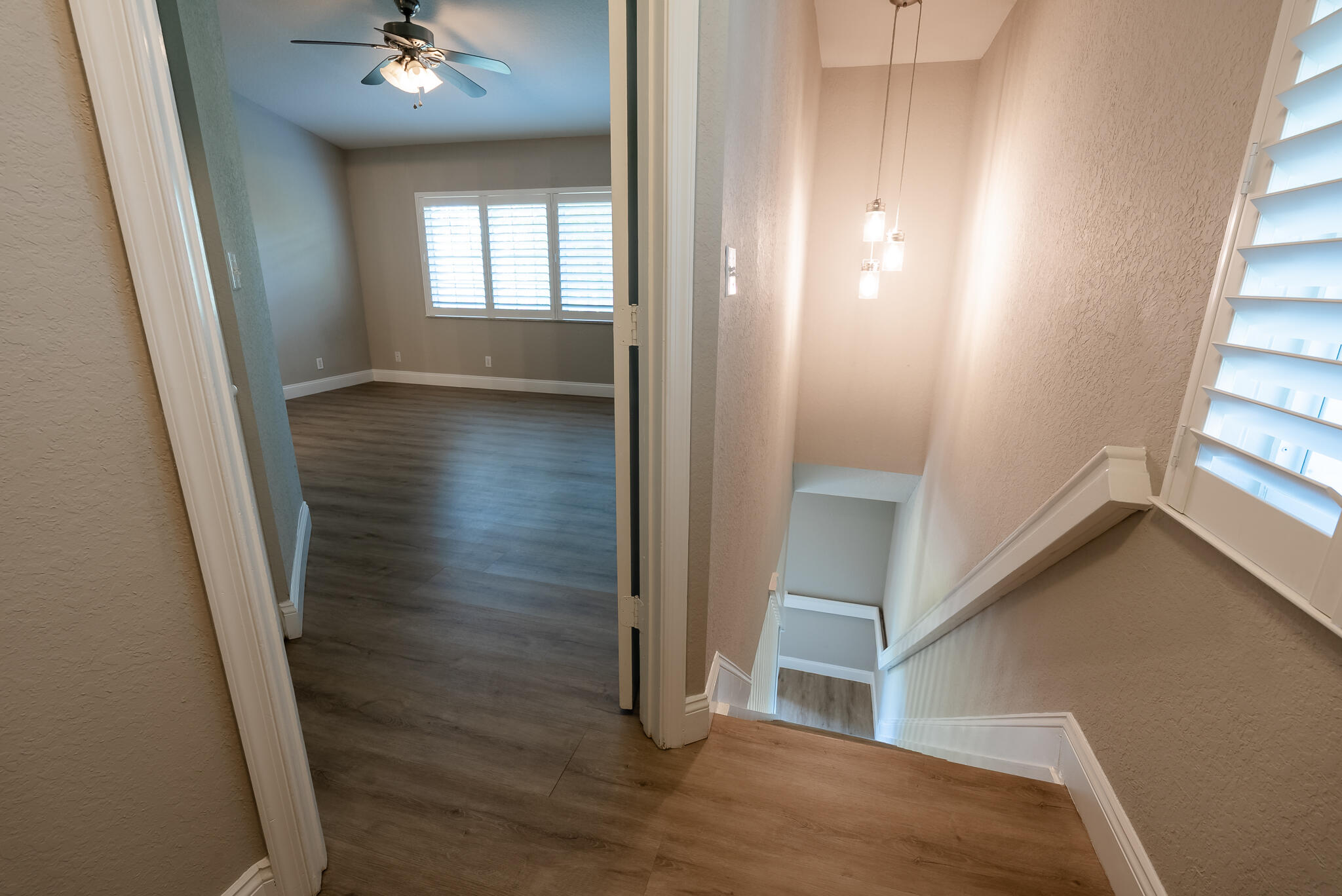 UPSTAIRS VIEW INTO PRIMARY BEDROOM