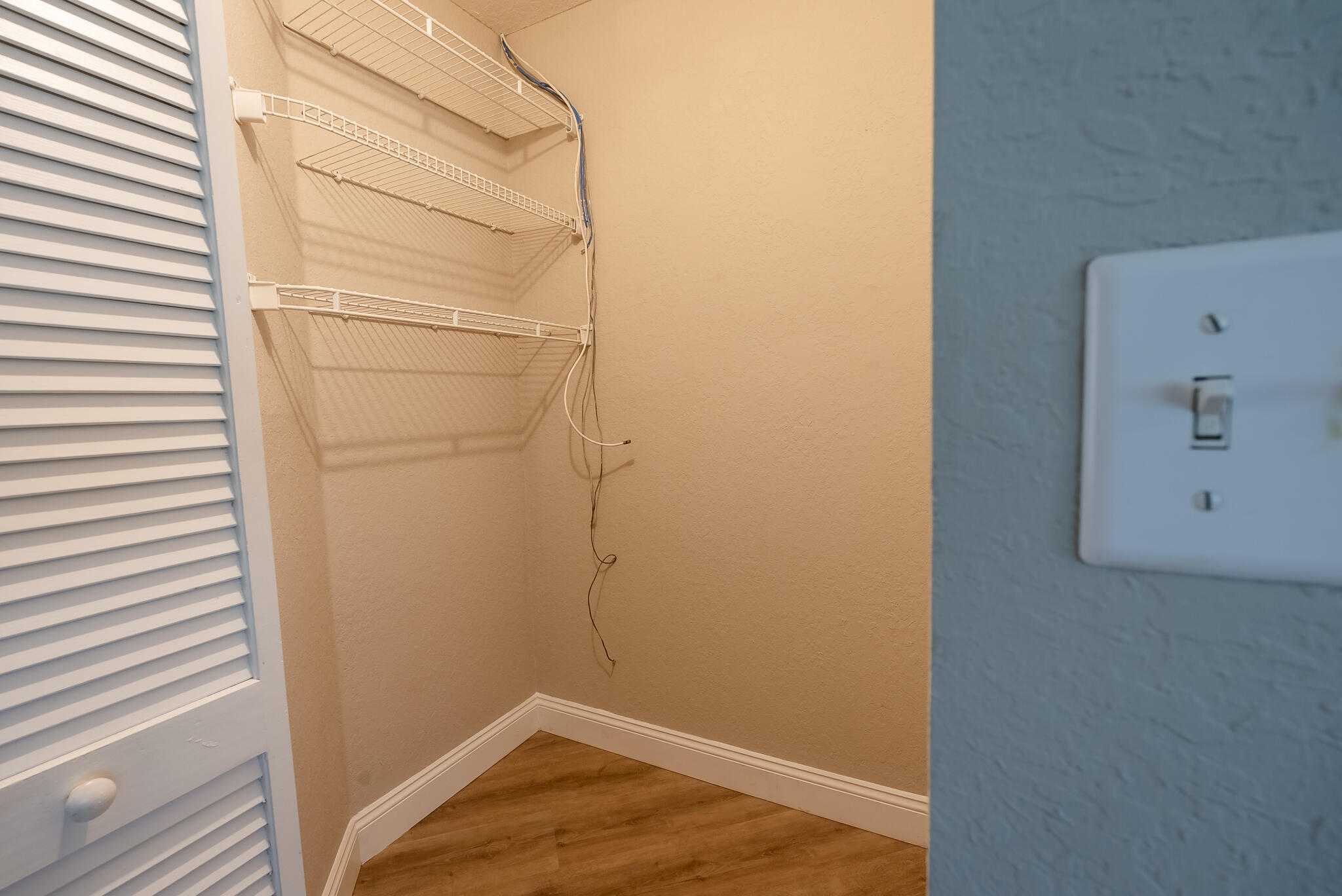 ONE OF TWO WALK-IN CLOSETS