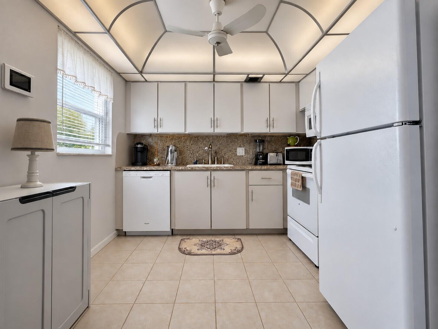 Spacious Kitchen With Updated Cabinets, Granite Look Counters, and Windo for Natural Light Spacious Kitchen With Updated Cabinets, Granite Look Counters, and Windo for Natural Light