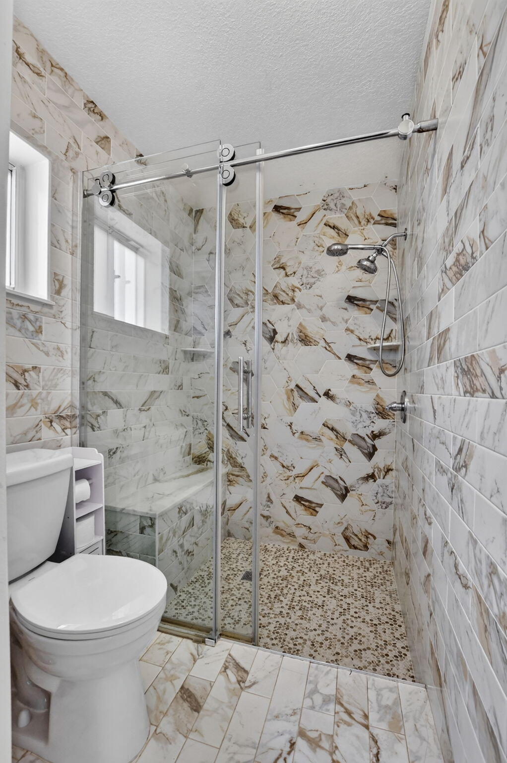 Stunning floor to ceiling tile in Master bath, walk in shower primary ensuite