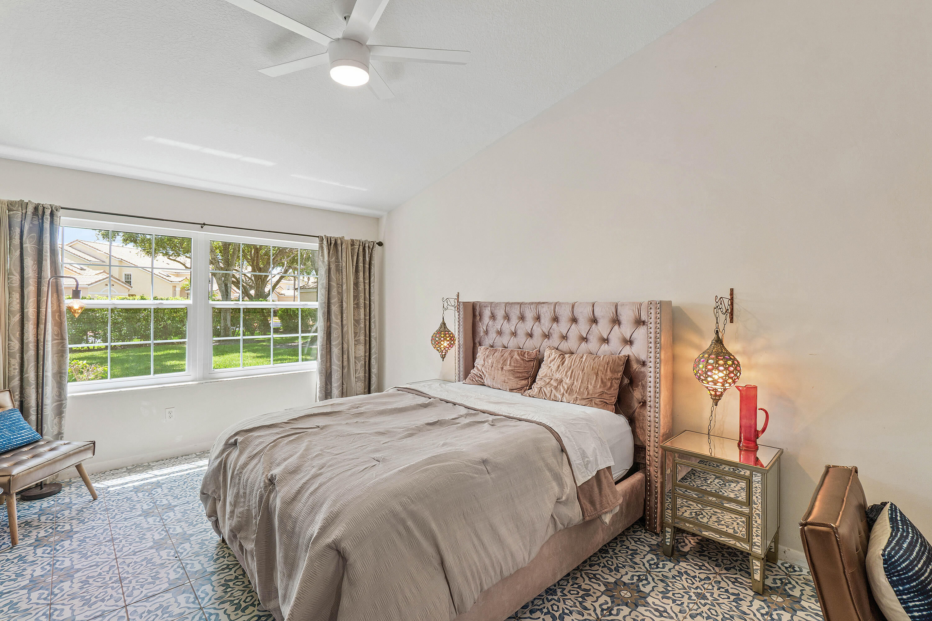 Primary bedroom with soaring ceilings