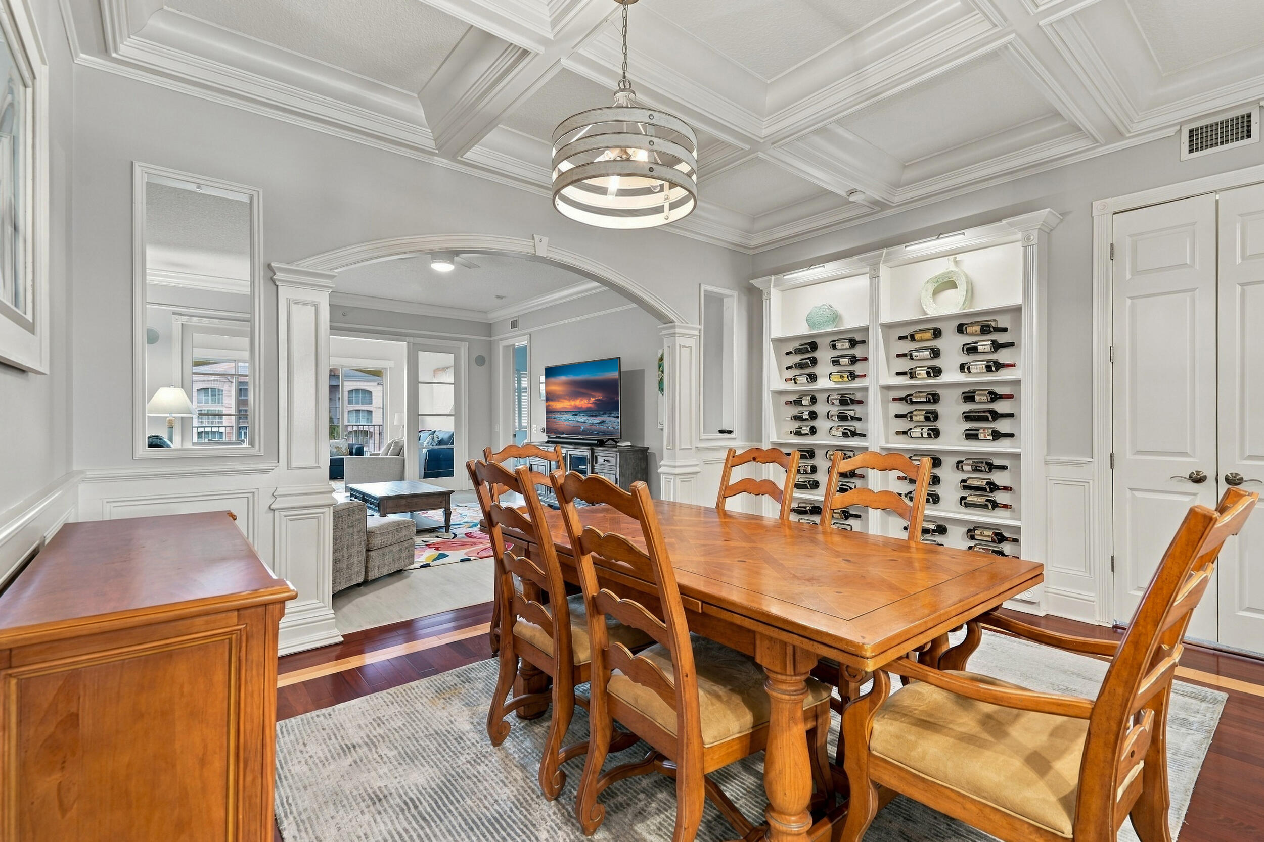 This condo features so many upgrades. Dining room has wood flooring with an inlay, custom wine rack, coffered ceiling, crown molding, archway, and stylish lighing. This condo features so many upgrades. Dining room has wood flooring with an inlay, custom wine rack, coffered ceiling, crown molding, archway, and stylish lighing.