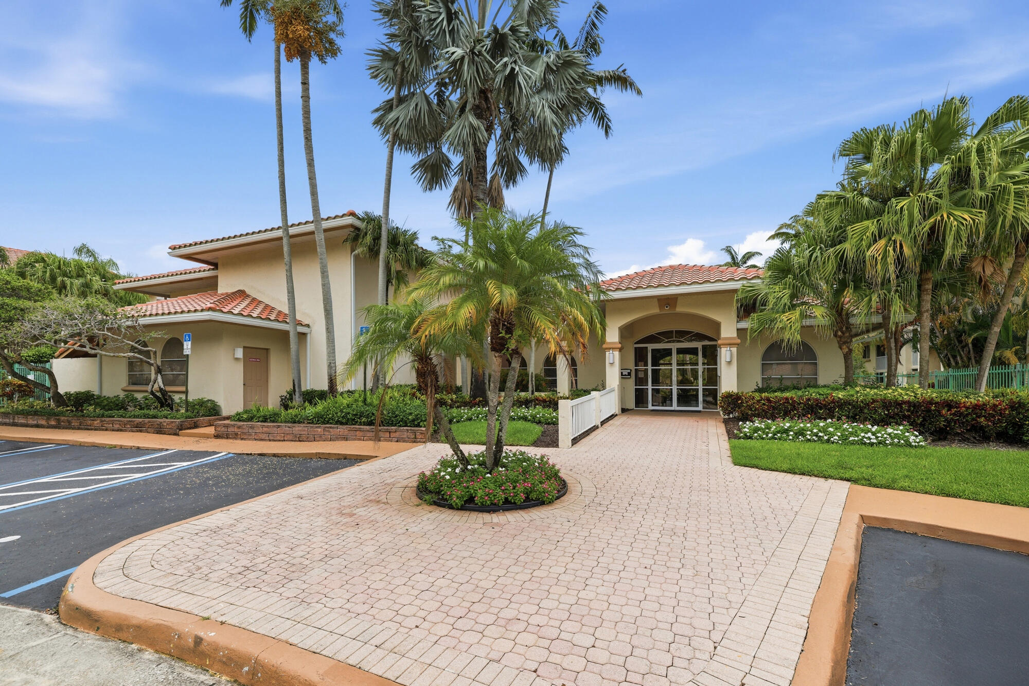 Mediterranean-style building with a terracotta tile roof and stucco exterior