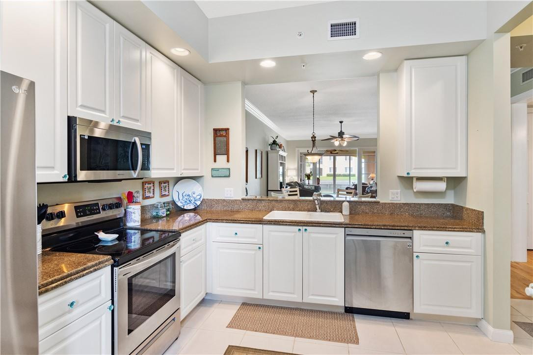 Spacious kitchen has newer stainless appliances, plenty of cabinet space, and breakfast area.