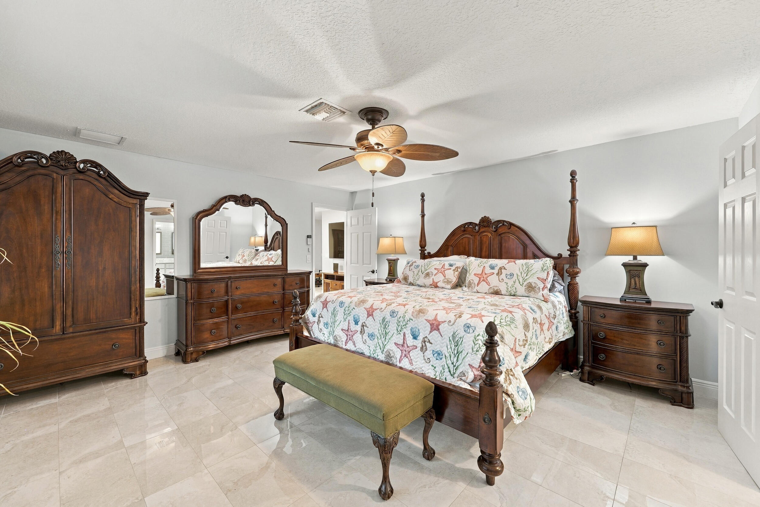 The primary suite has everything you have been looking for: spacious and elegant, with a walk-in closet, a fully updated en-suite bathroom, and lots of natural light.