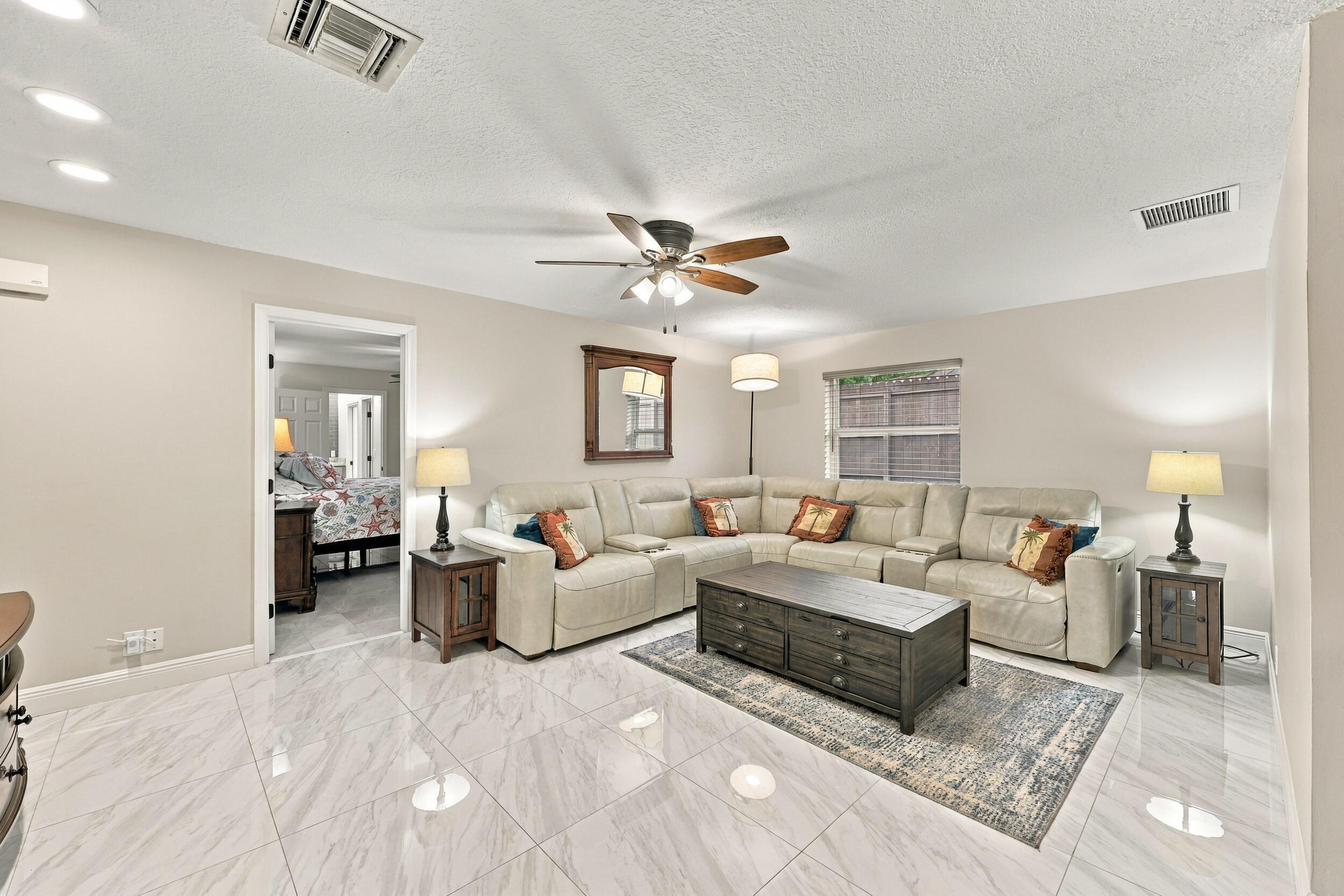 The family room is a versatile space for children of all ages. Relax and enjoy a separate area away from the kitchen and formal living room that also provides direct access through sliding glass doors to the covered patio and one-of-a-kind backyard.