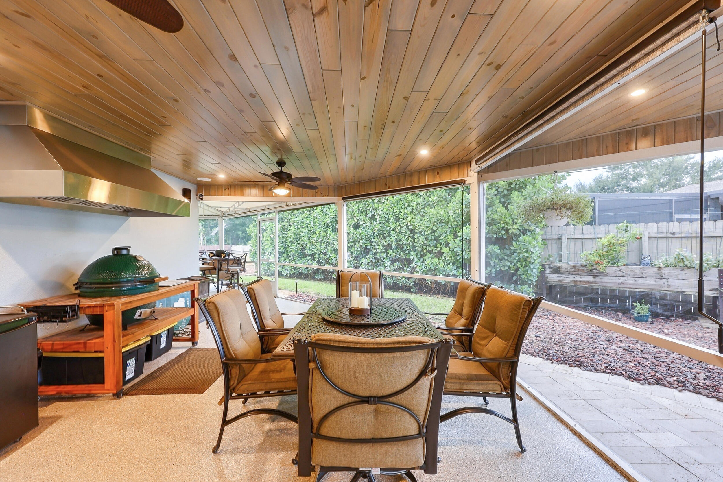Live the epitome of the South Florida lifestyle with this 1,360 sq. ft. patio. It offers a built-in bar with quartz countertops, a grill area with hooded exhaust, eye-popping tongue & groove ceilings, recessed lights, tons of privacy and views of Lakeview Golf Course.