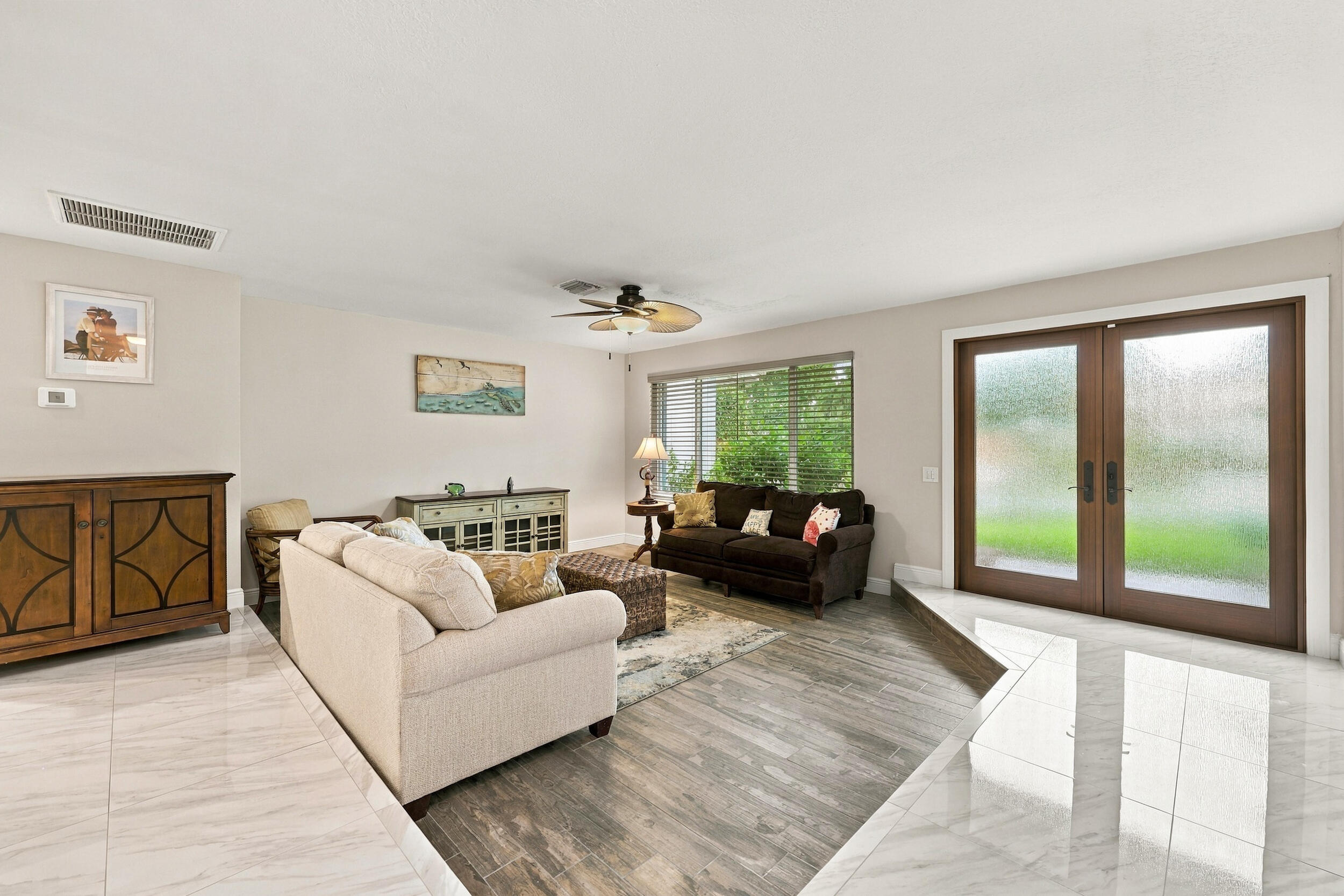 A spacious and versatile floor plan offers a formal living area that flows nicely into the updated kitchen and then into a family or bonus room. Everything revolves around the pool, the resort-style pool, and the 900-square-foot covered, screened-in patio.