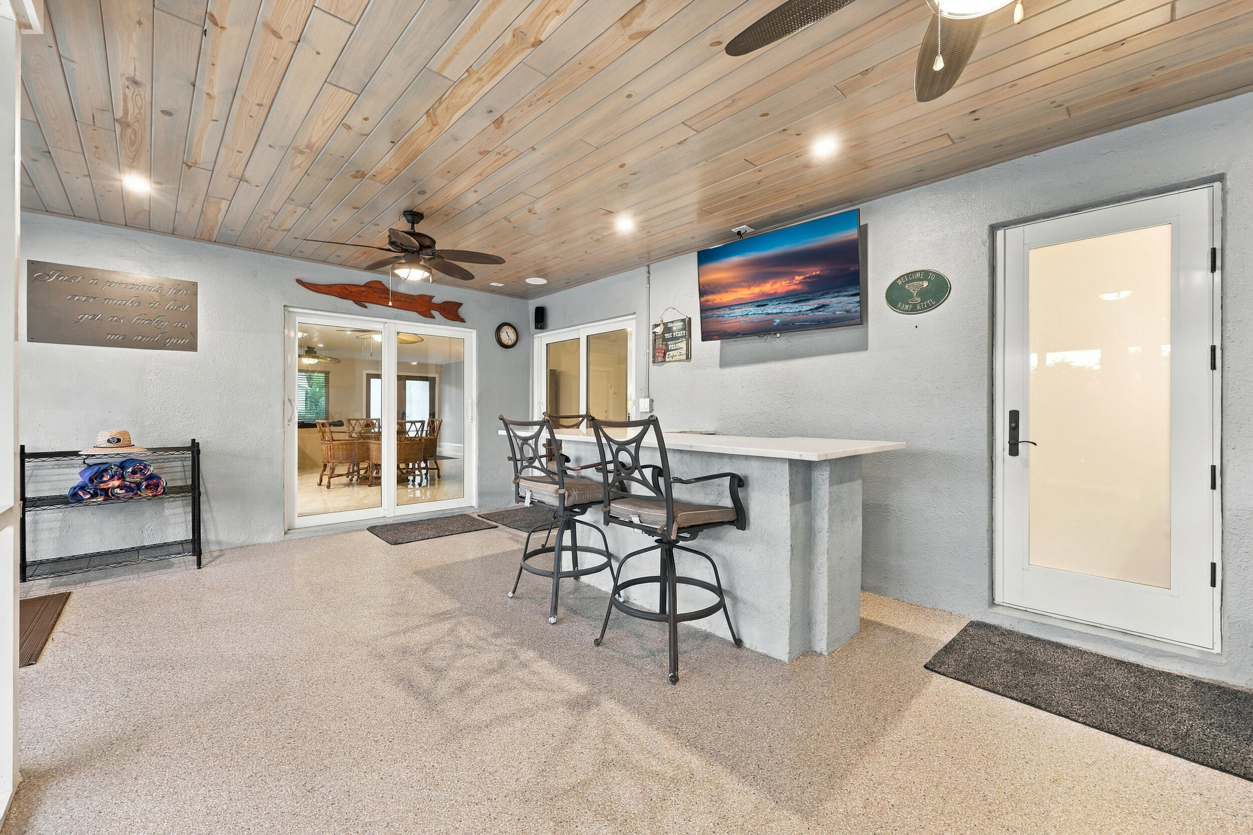 Live the epitome of the South Florida lifestyle with this 1,360 sq. ft. patio. It offers a built-in bar with quartz countertops, a grill area with hooded exhaust, eye-popping tongue & groove ceilings, recessed lights, tons of privacy and views of Lakeview Golf Course.