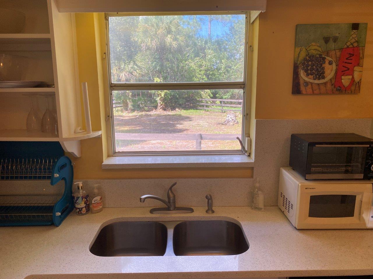 Kitchen with Dishwasher, Range/Oven and Ample Storage with View to Paddock