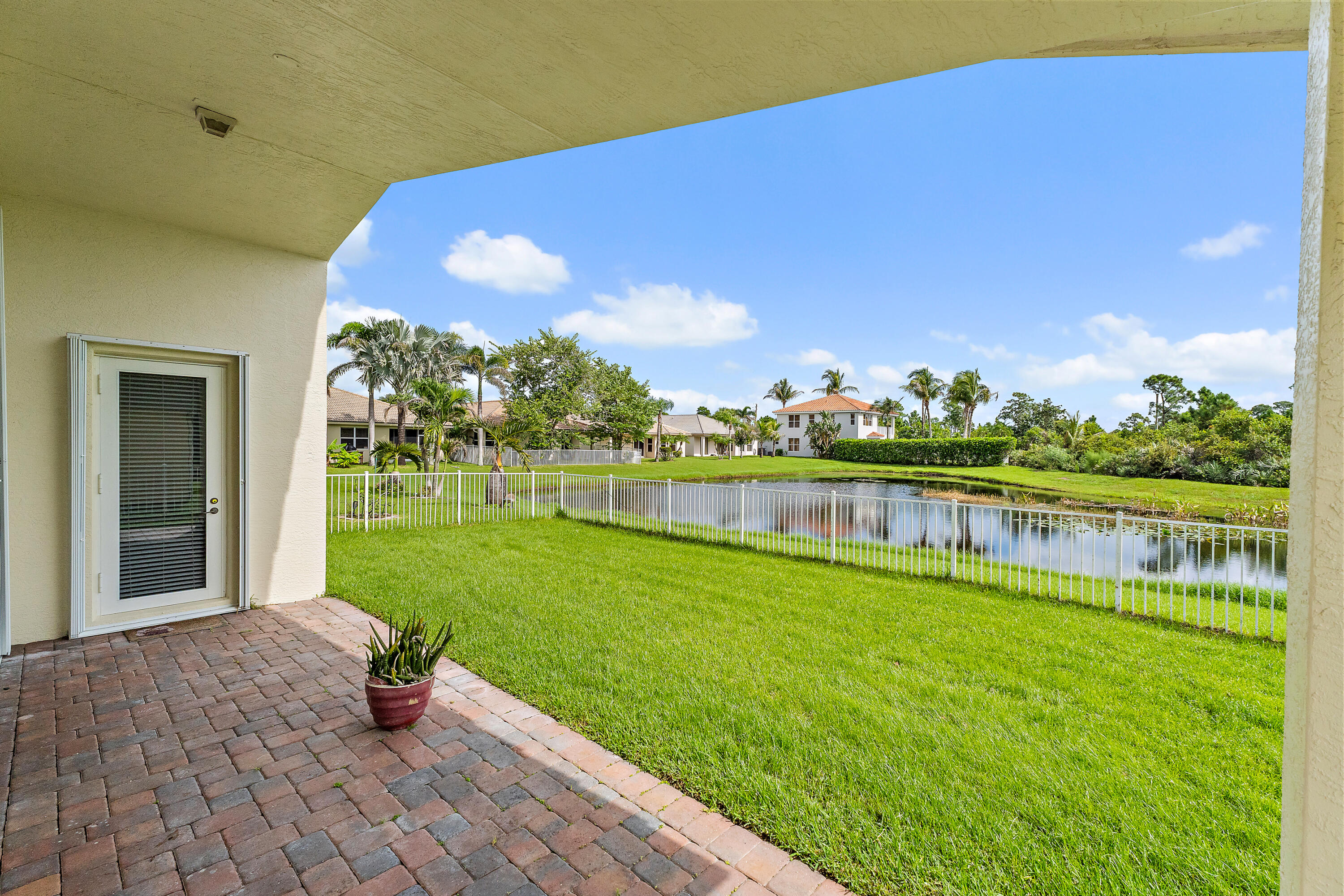 From Living room or the primary Bedroom access the back patio. Its very beautiful back there.