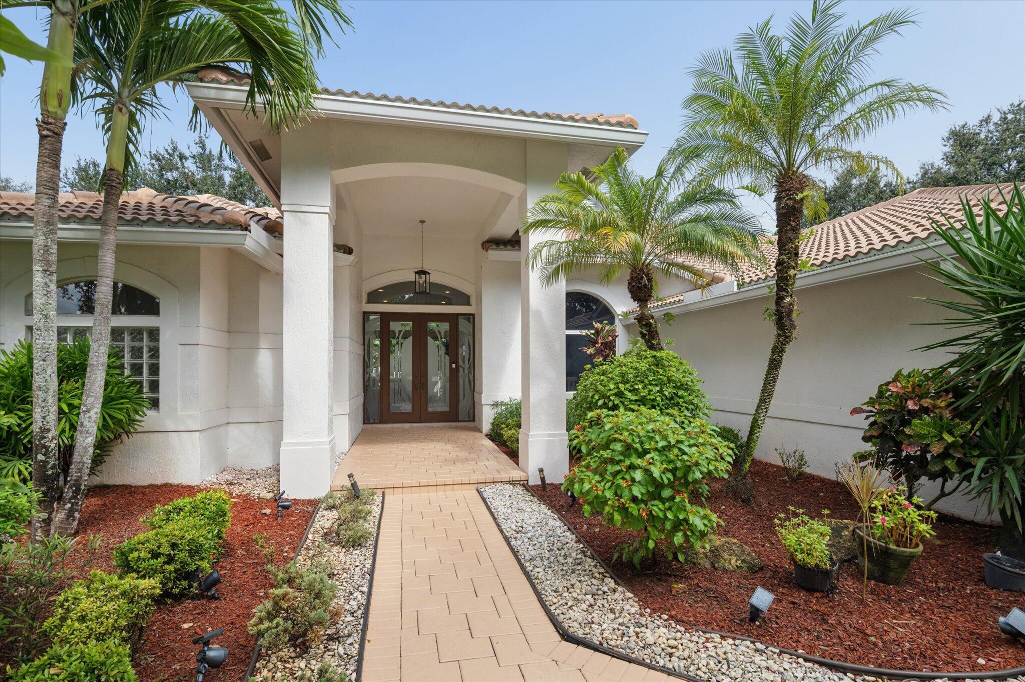 Lush Landscaped walkway to entry