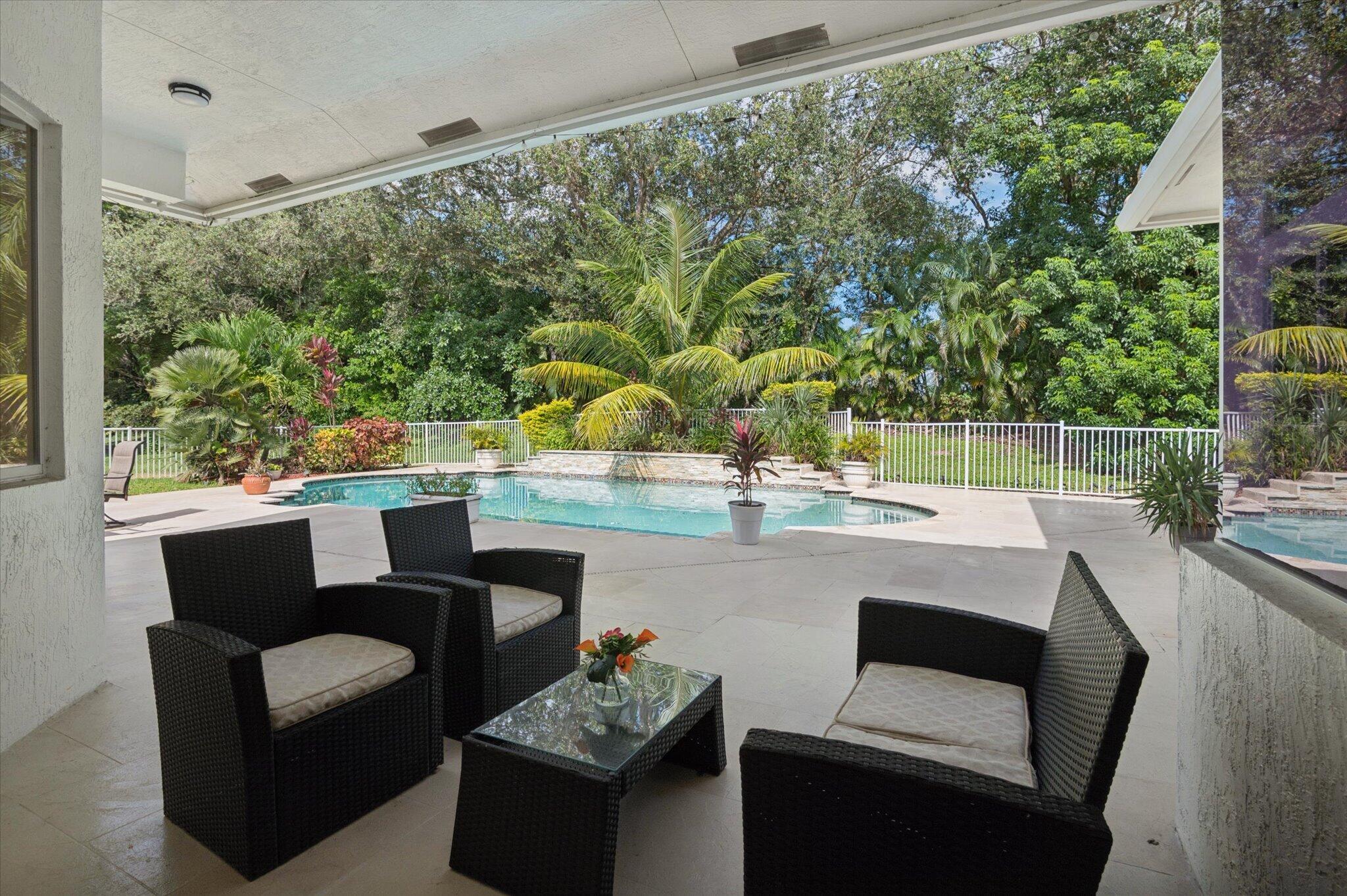 Back patio with mature landscaping