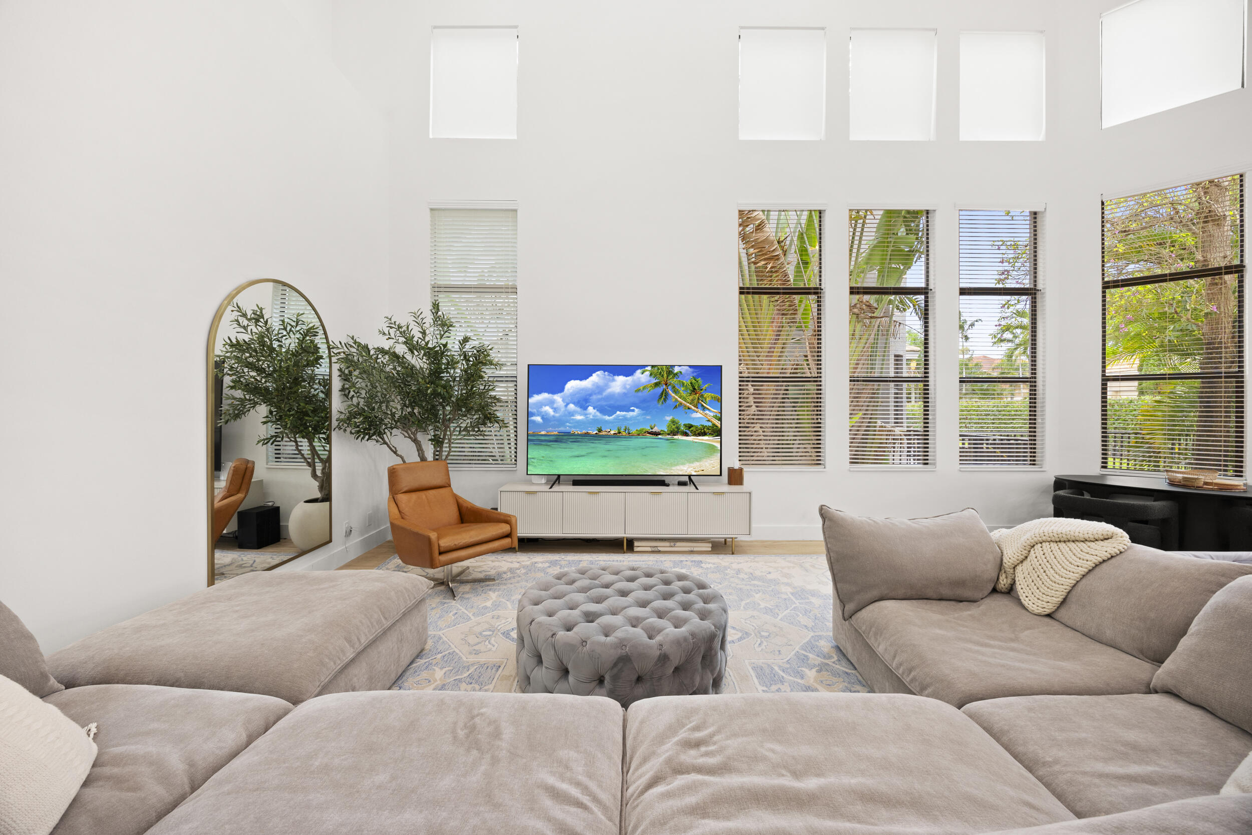 Double-height ceilings featuring floor-to-ceiling windows and clerestory windows