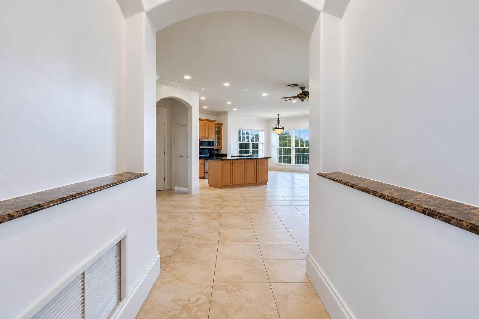 Symmetrical Modern Foyer and Open Kitche