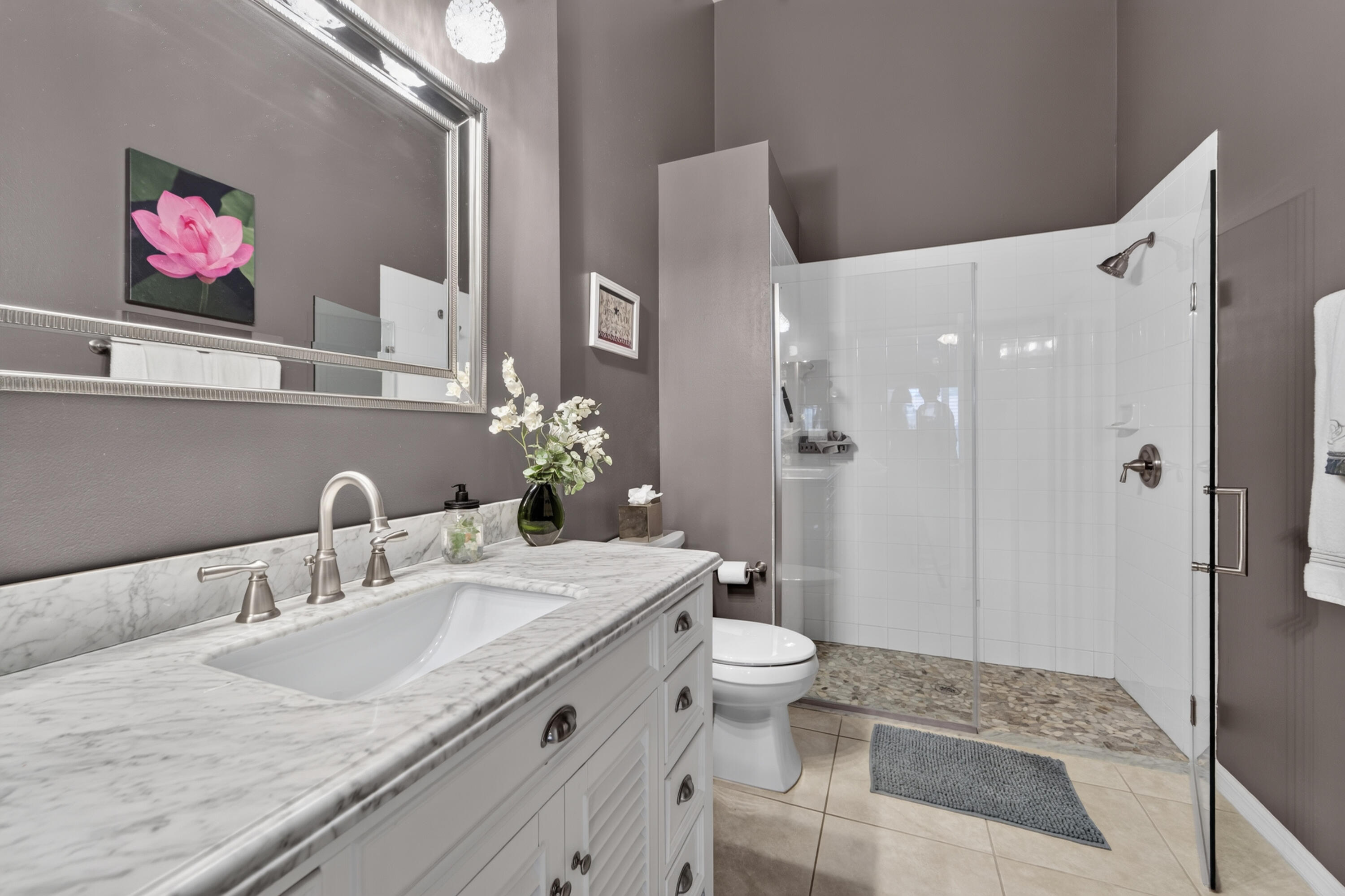 Primary suite private updated bath, granite counters, and newer shower, \