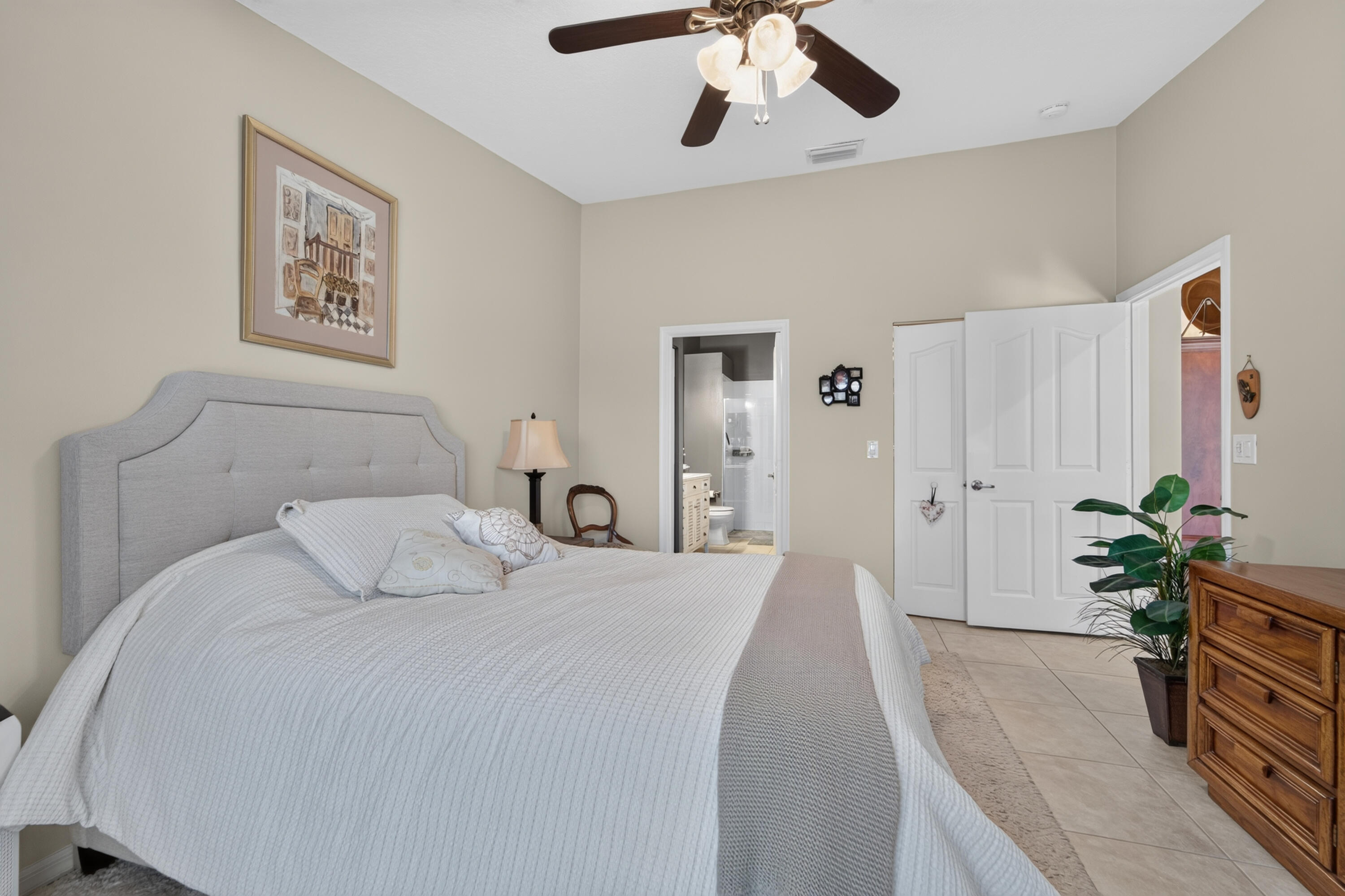 Primary suite has separate bath and huge walk in closet with organized shelves