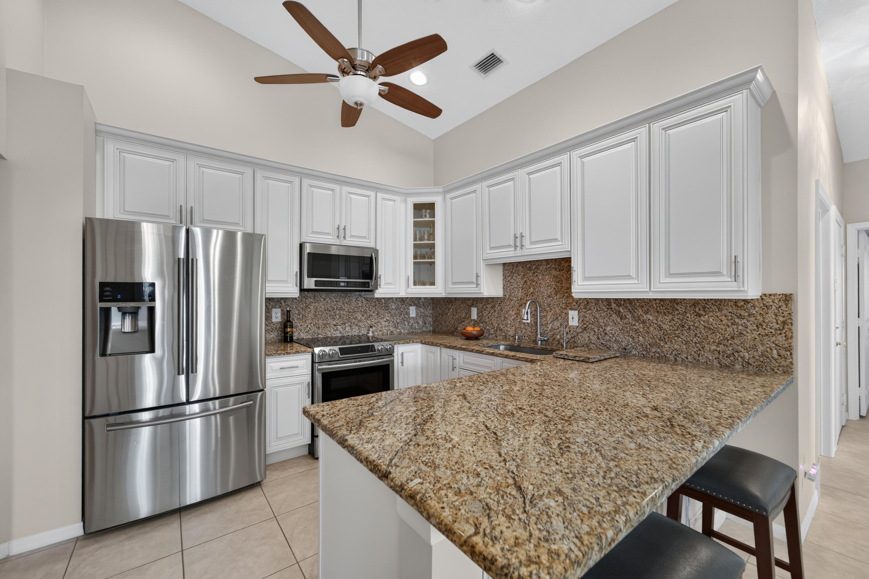 Recess lighting and vaulted ceilings give this home a spacious feeling