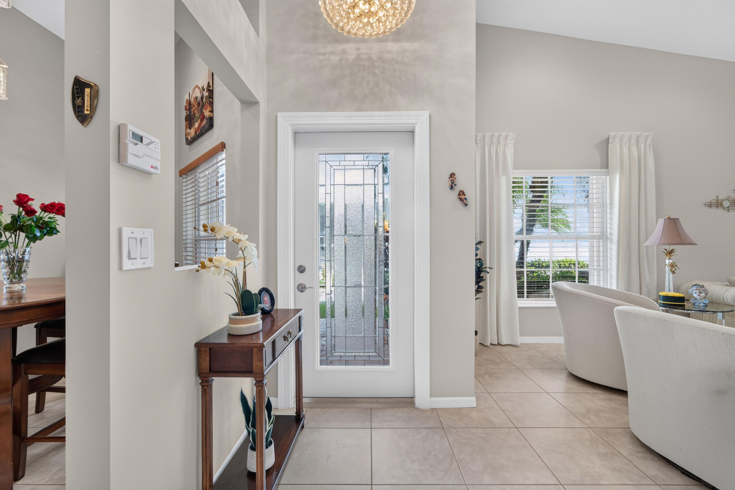 Side private glass edged door entrance, all ceramic floors throughout