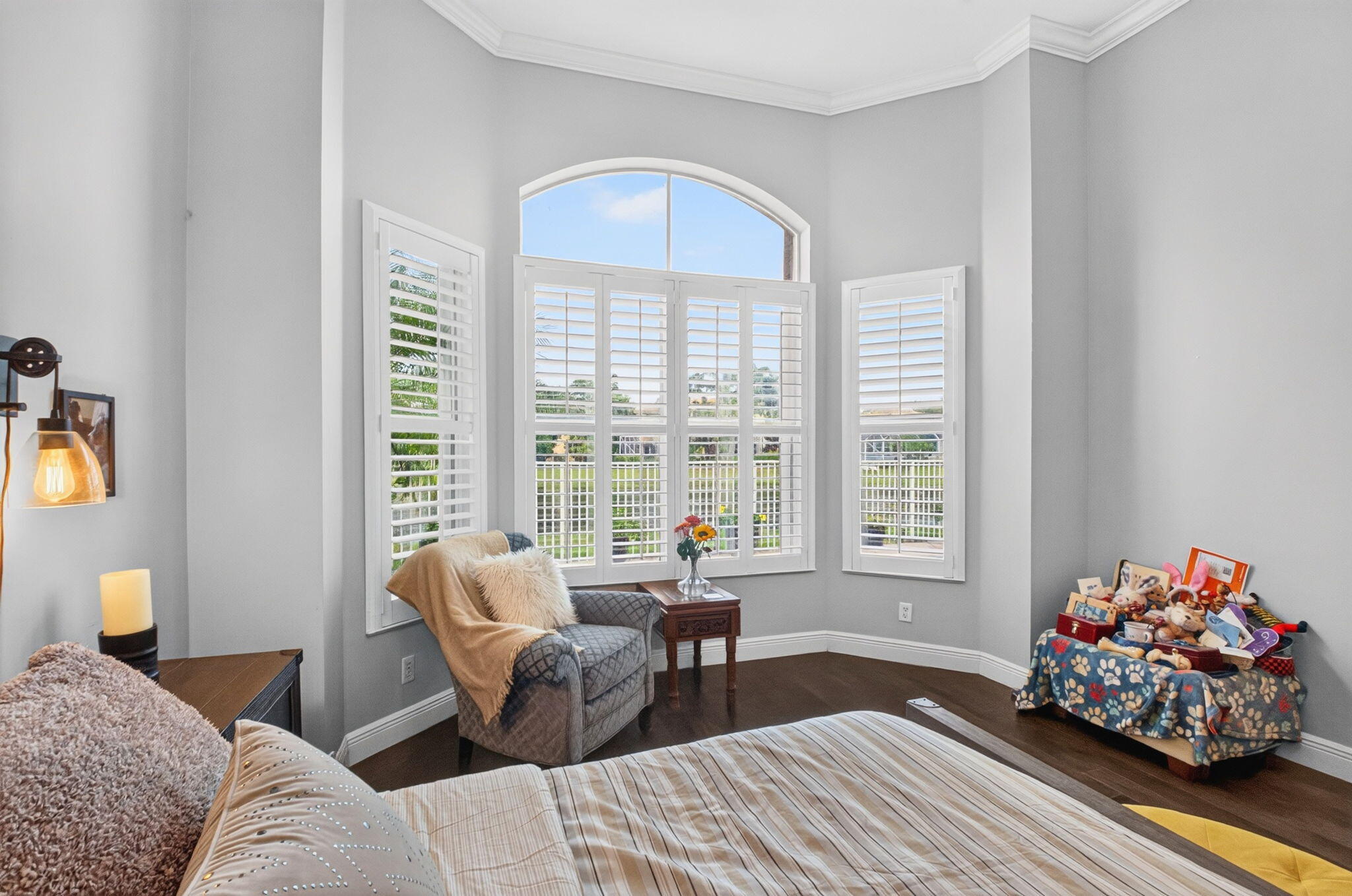 Bay window, plantation shutters, tray ceiling and crown molding