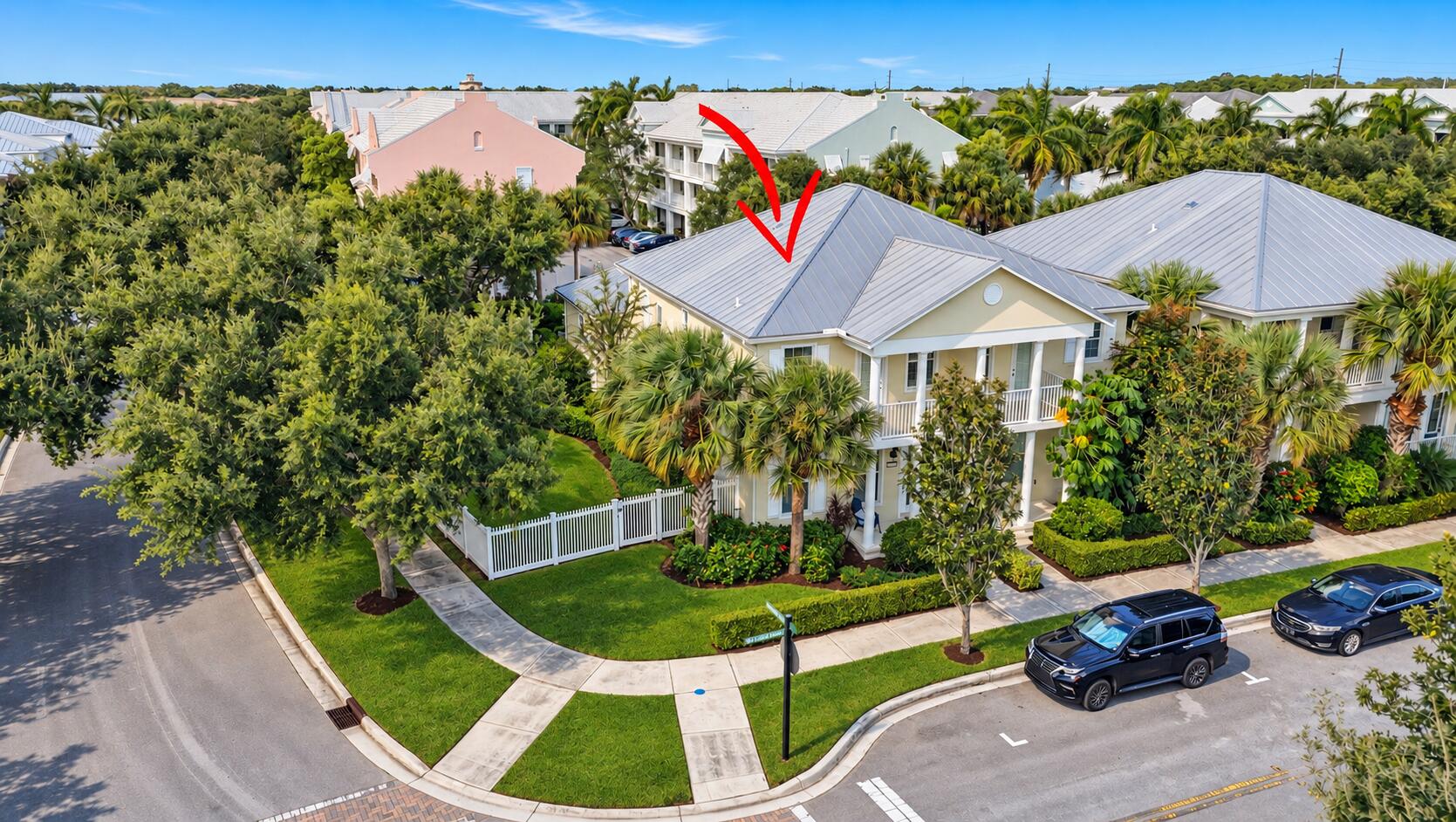 Aerial Coastal Home with Red Arrow