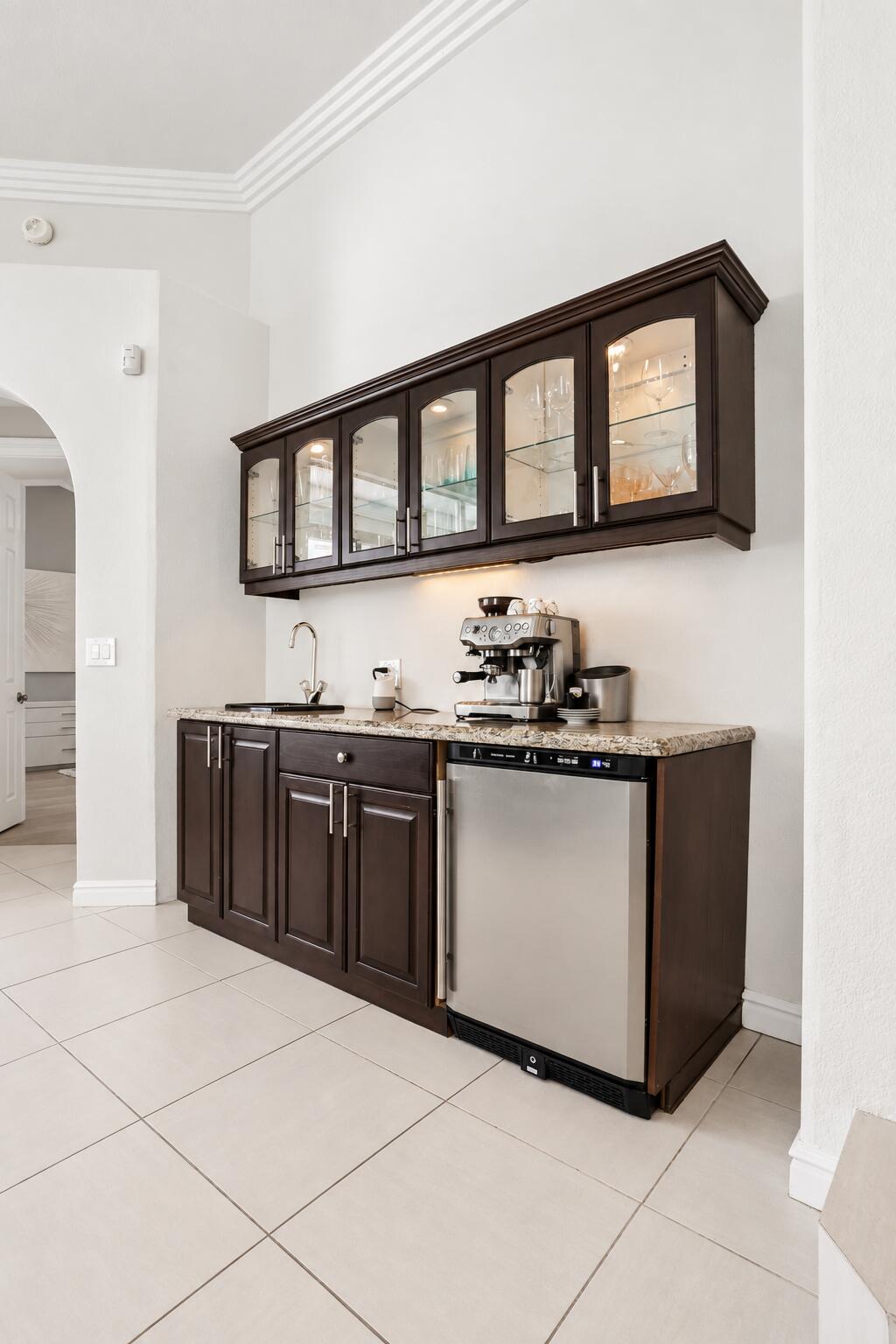 Elegant Espresso Wet Bar with Glassware