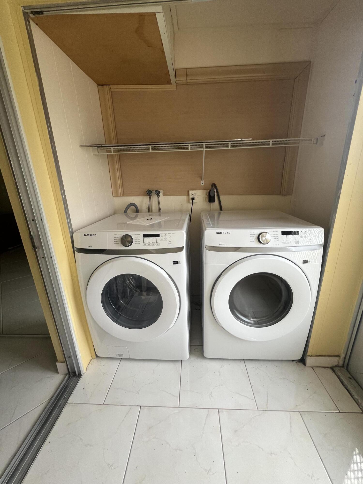full sized side by side washer/dryer on the patio utility closet.
