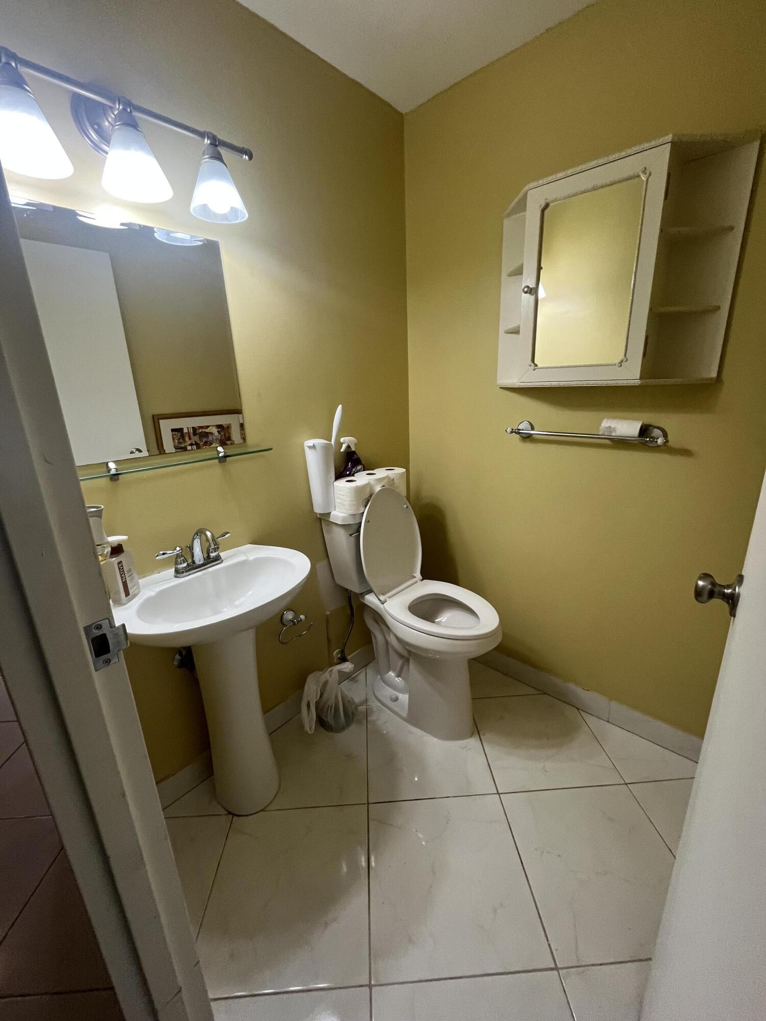 updated 1/2 bathroom with pedestal sink
