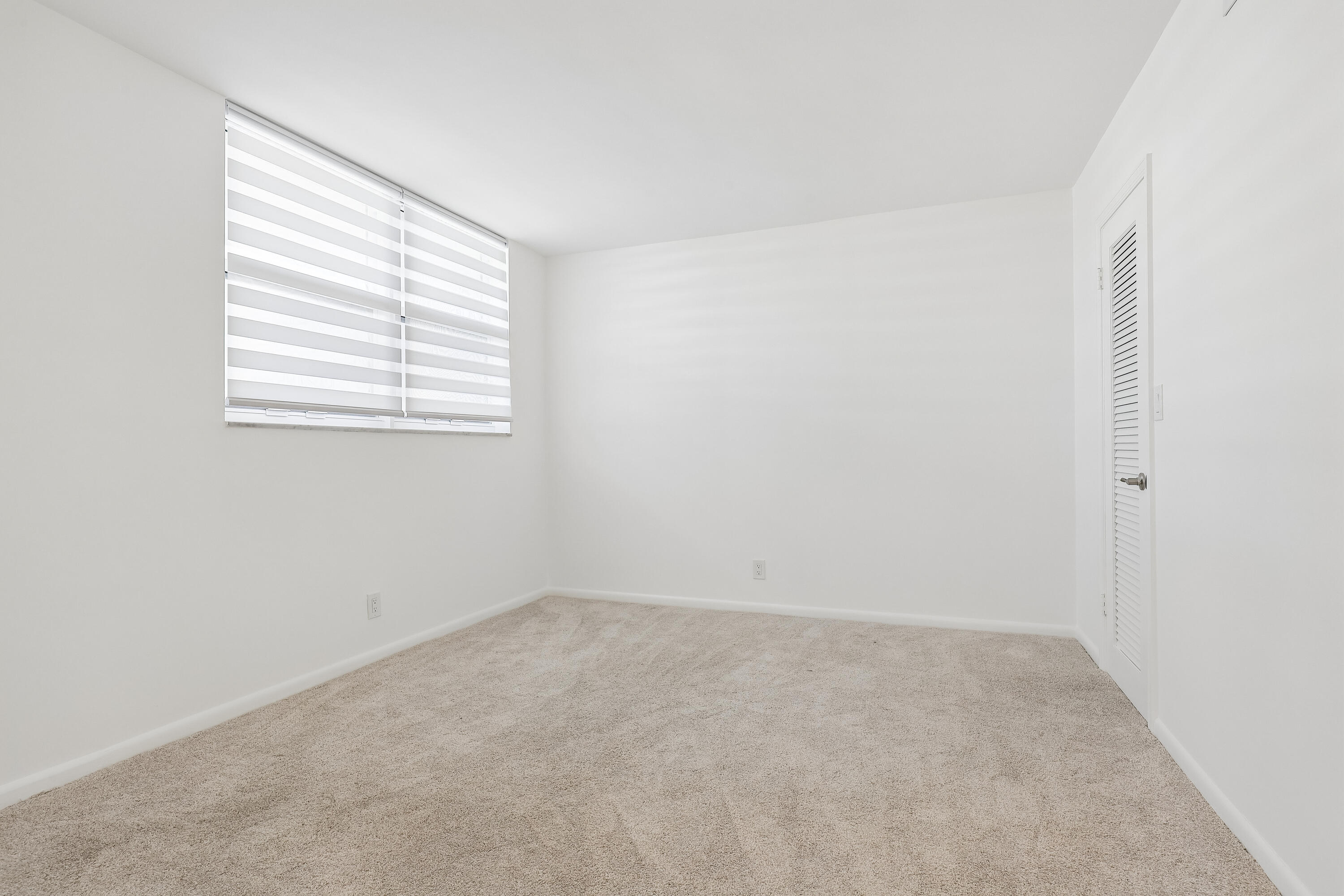 Guest bedroom has a very large walk-in closet