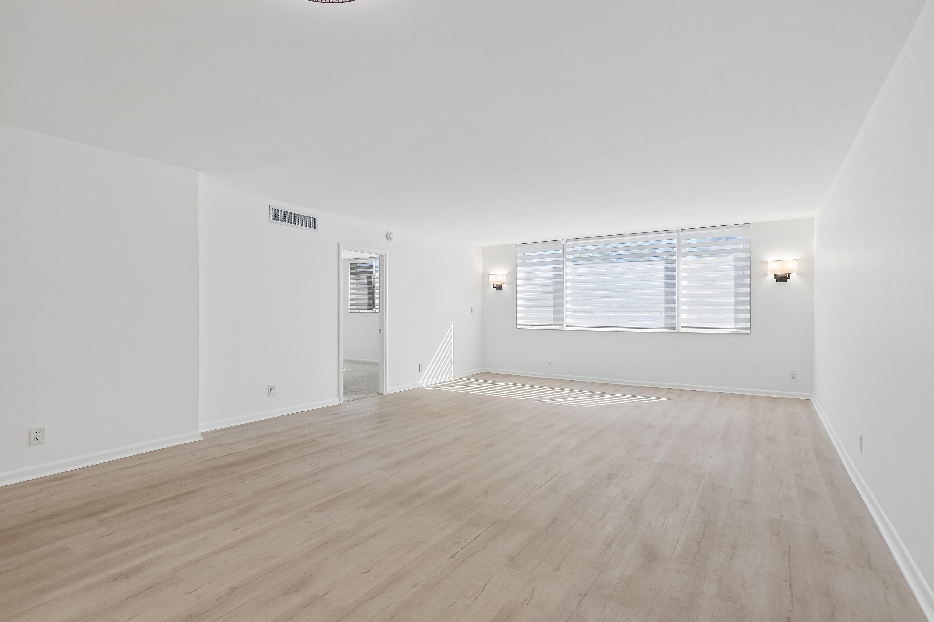 Luxury Vinyl flooring throughout the living/dining area.