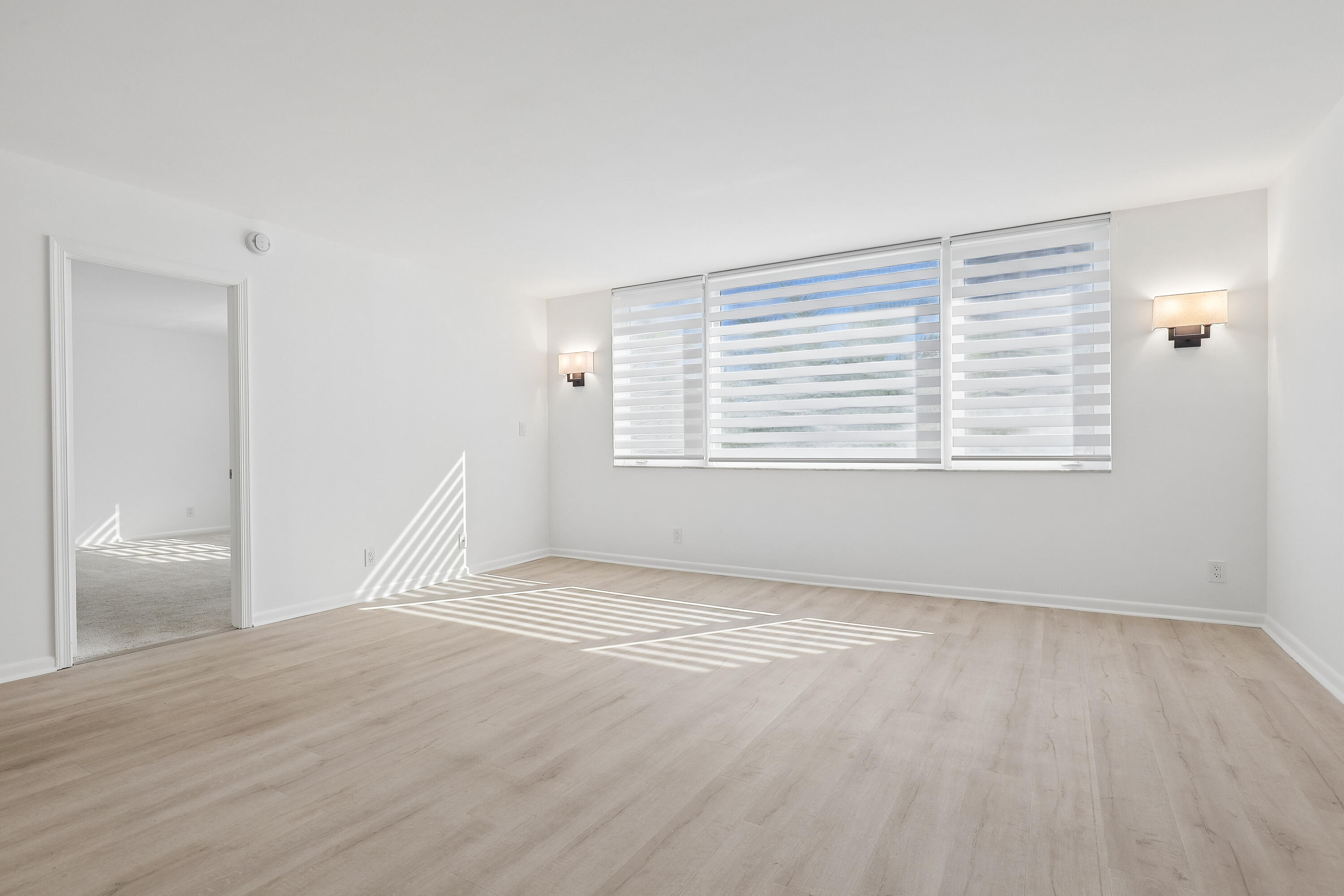 It is a split bedroom plan with the primary bedroom on the East side.