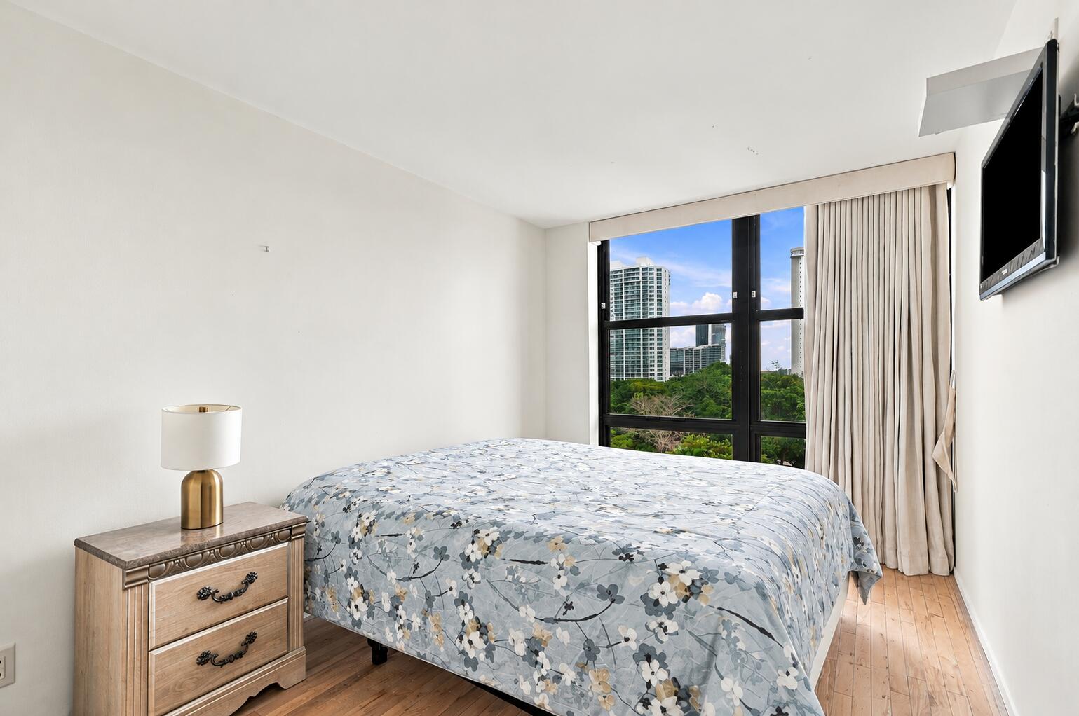 Tidy Floral Bedroom with City View