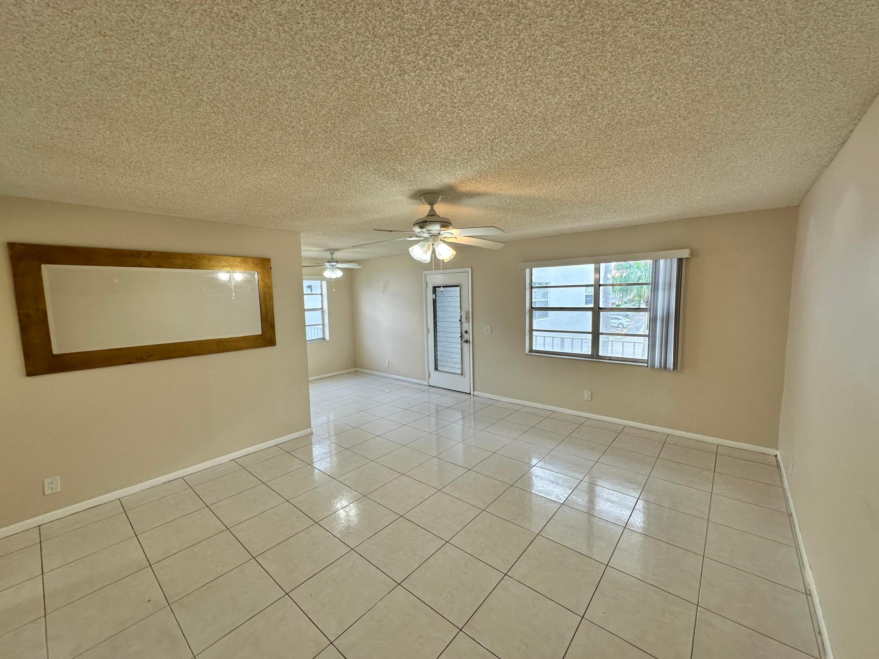 Spacious Living and Dining Area with Kitchen to the Left