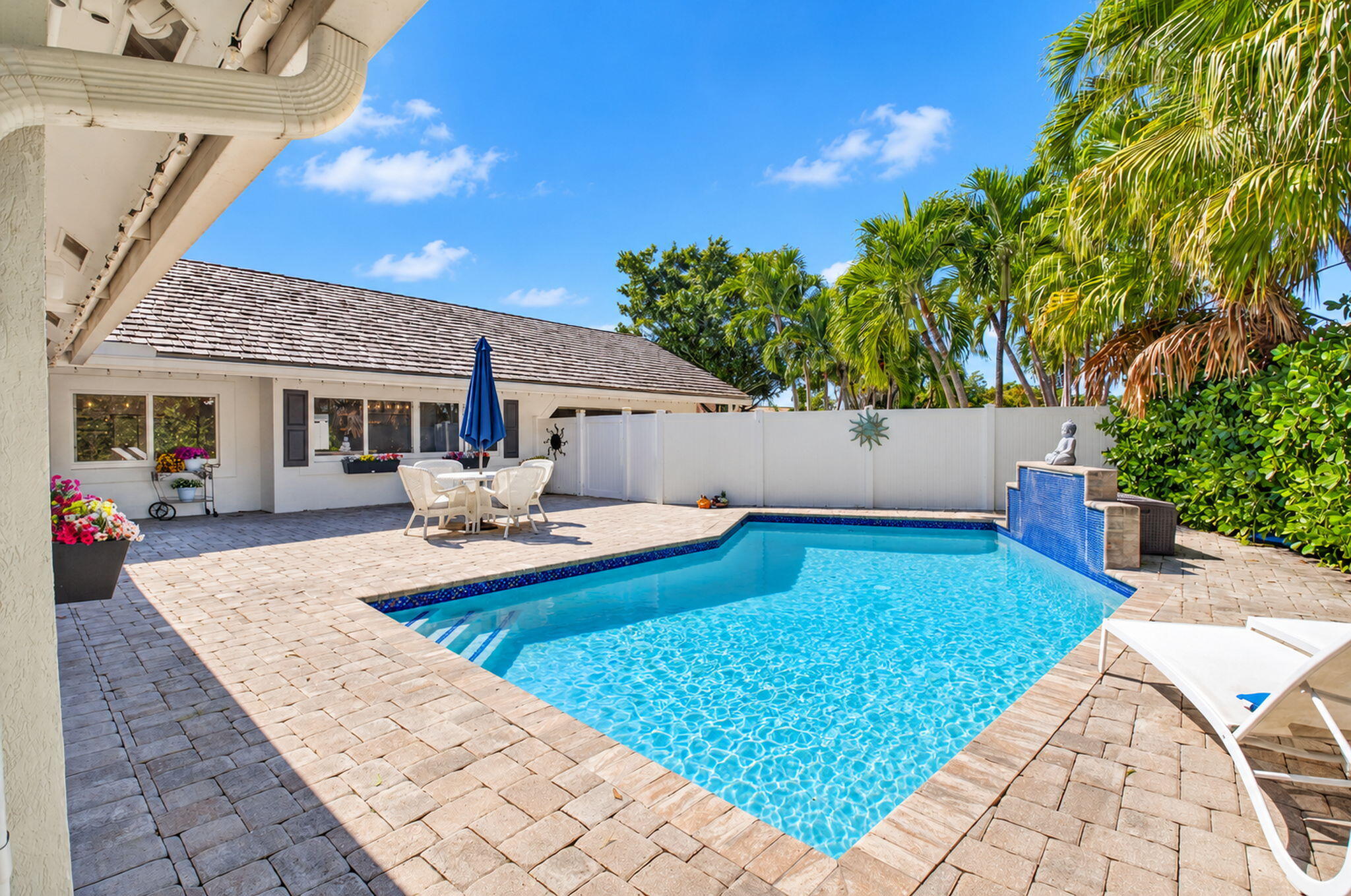 View of back of home and pool
