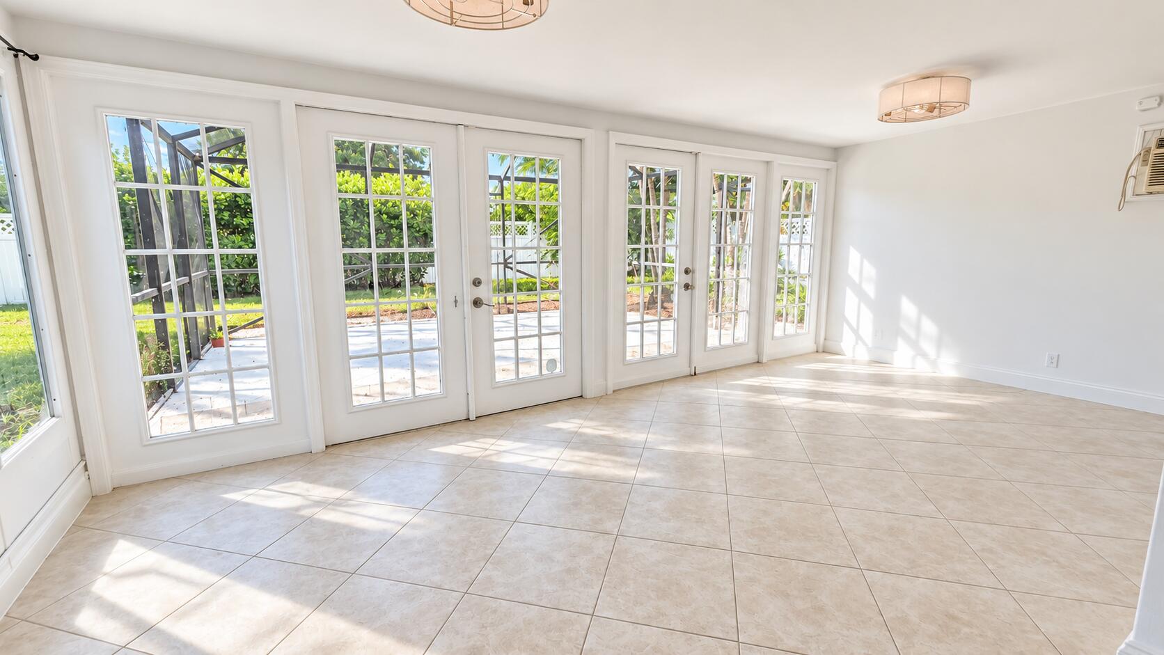 Sunlit Modern Sunroom with French Doors