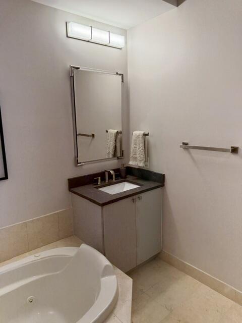 Primary Bath with Separate Sinks and Soaking Tub.