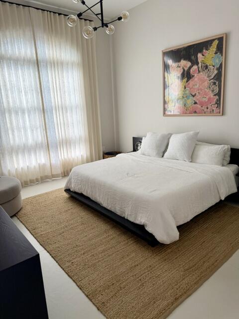 Primary Bedroom Suite with high 11' Ceilings.