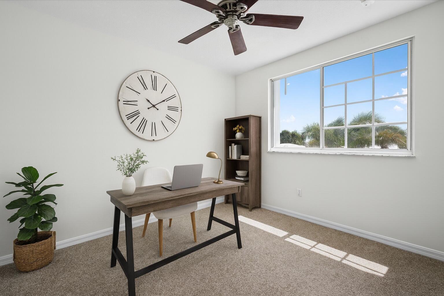 Virtually staged bedroom showcasing its potential as a comfortable home office or flex space.